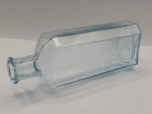 Old advertising chemist bottle. Army & navy junior stores
