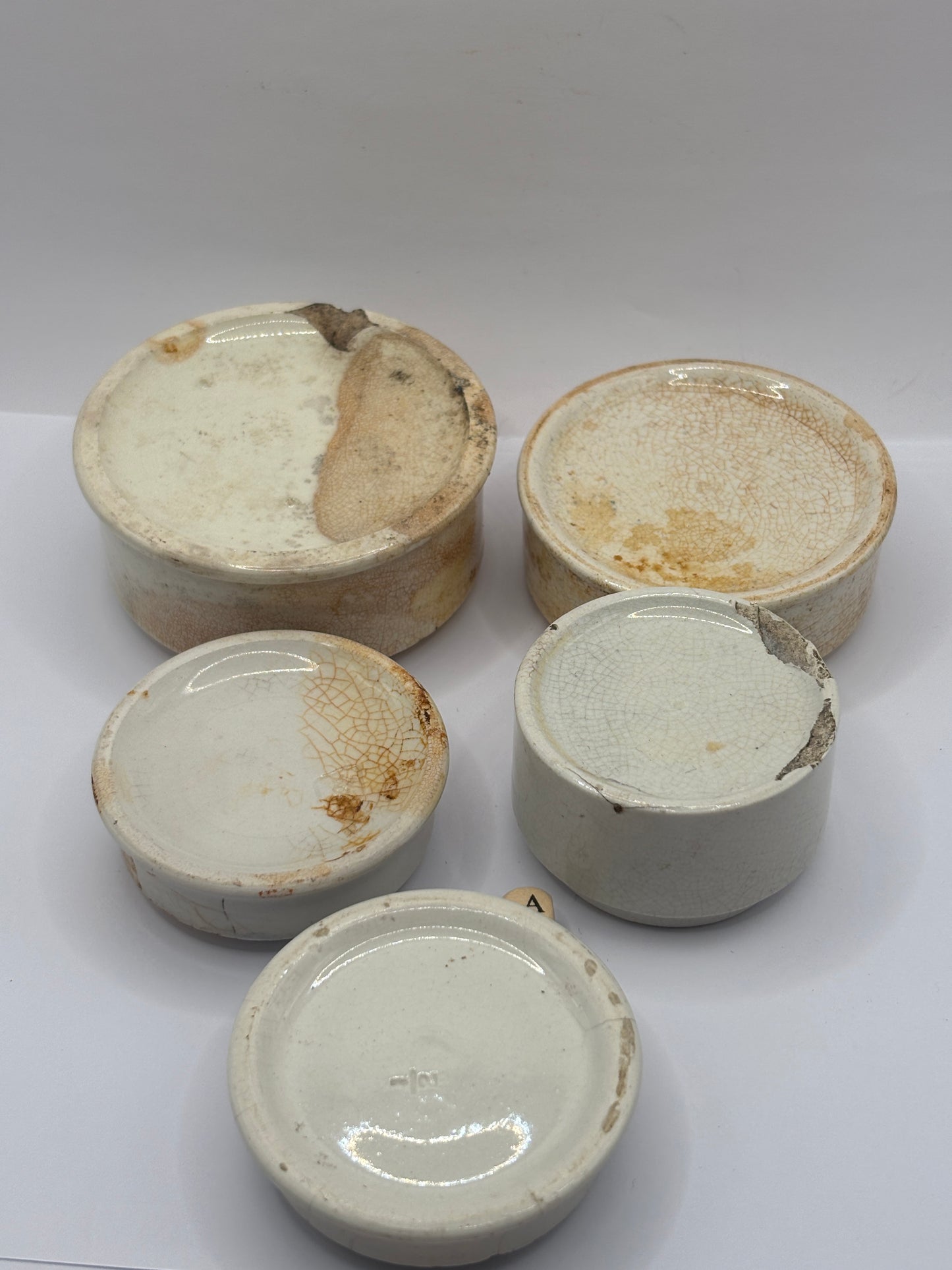 5 old pot lid bases, stackers, risers (a)