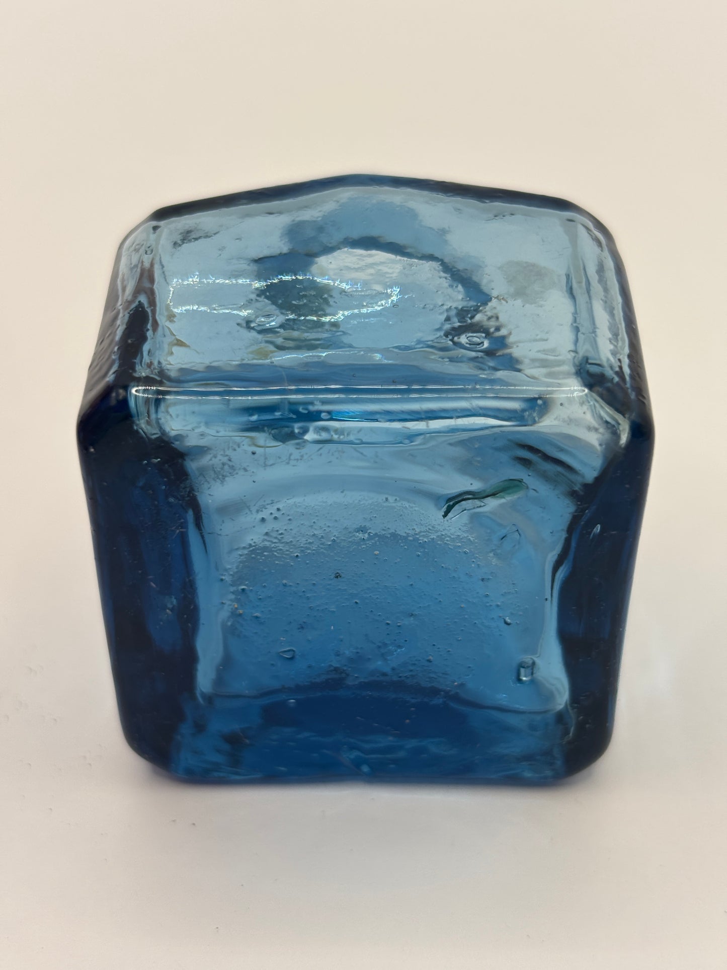 Old blue glass inkwell, penny ink with swirls. Damaged