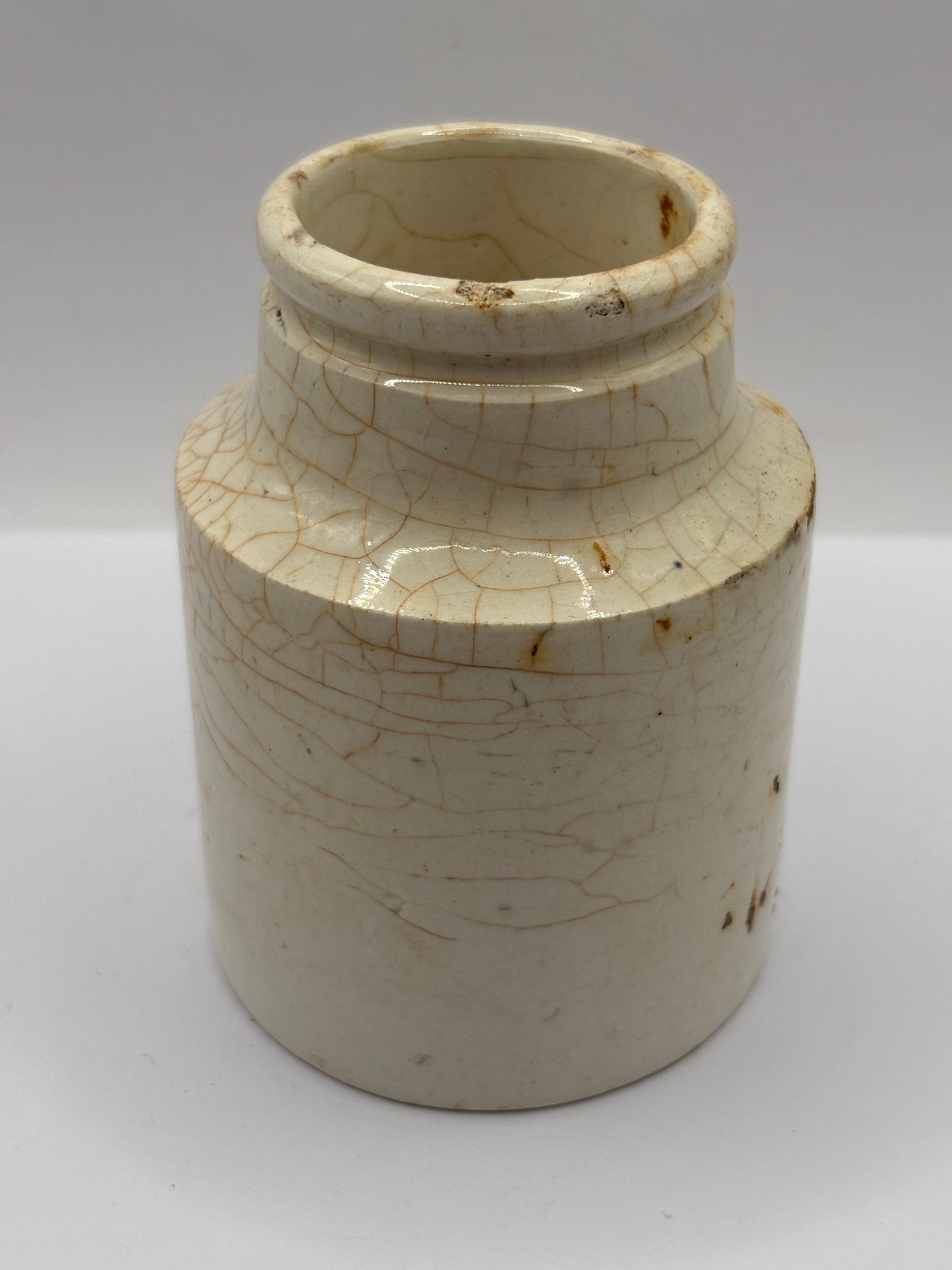 Old white stoneware jar, stained & crazed
