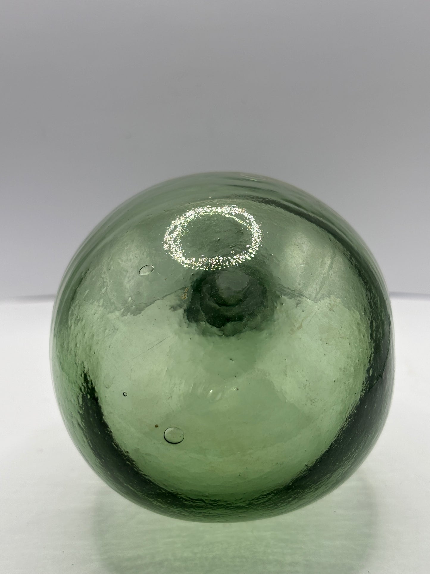 Old round bottom aqua glass bottle