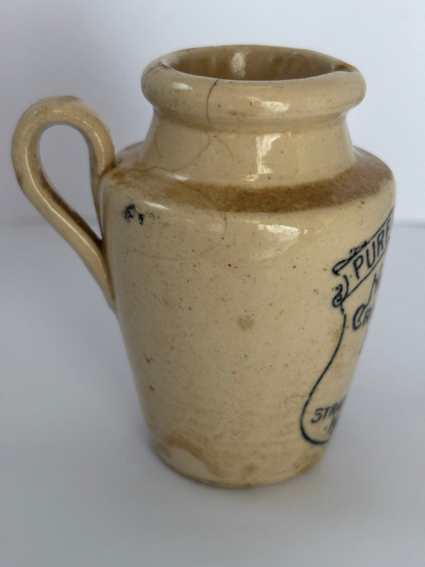Old Nidderdale advertising cream pot, 7.5cms