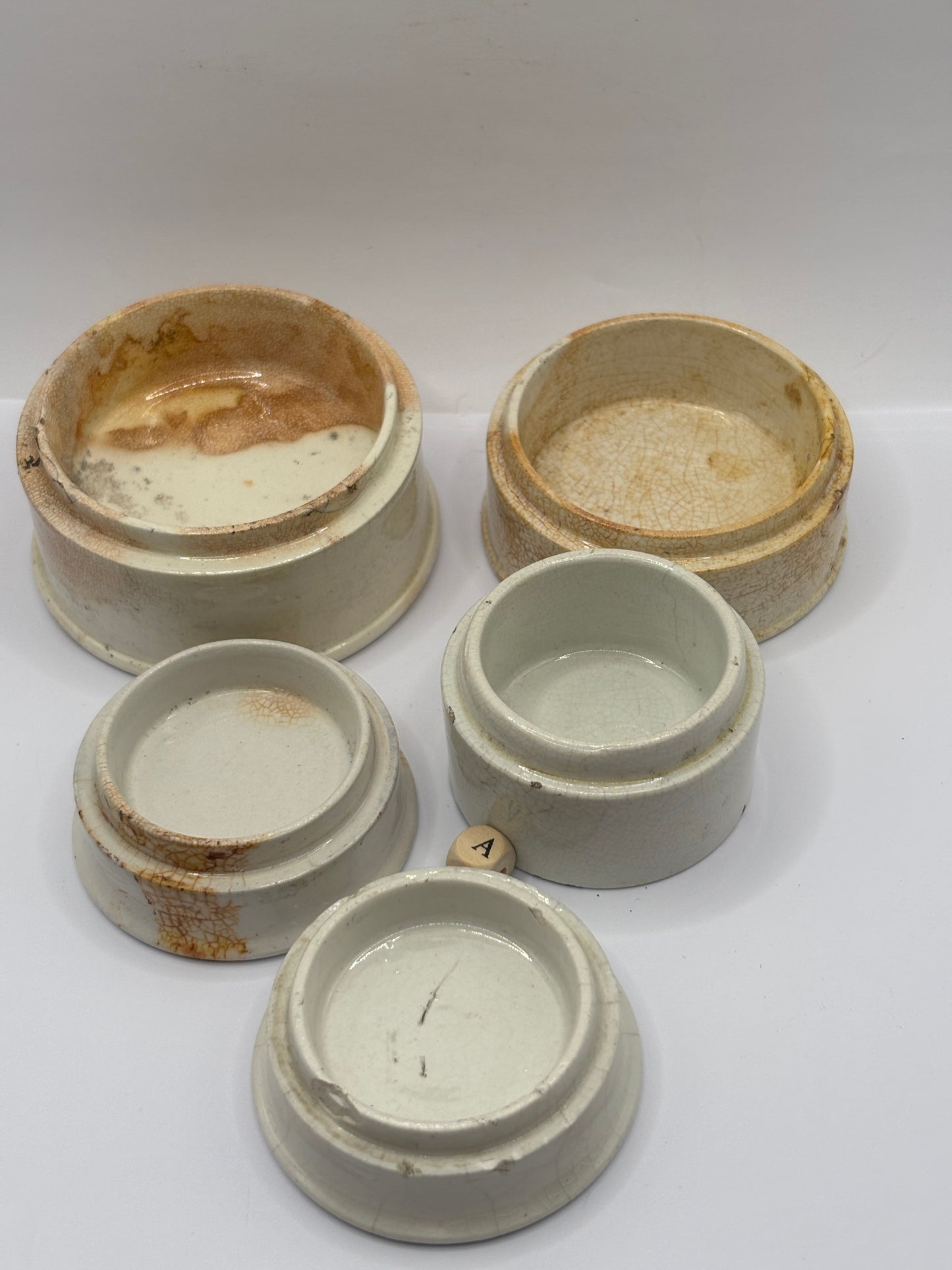 5 old pot lid bases, stackers, risers (a)