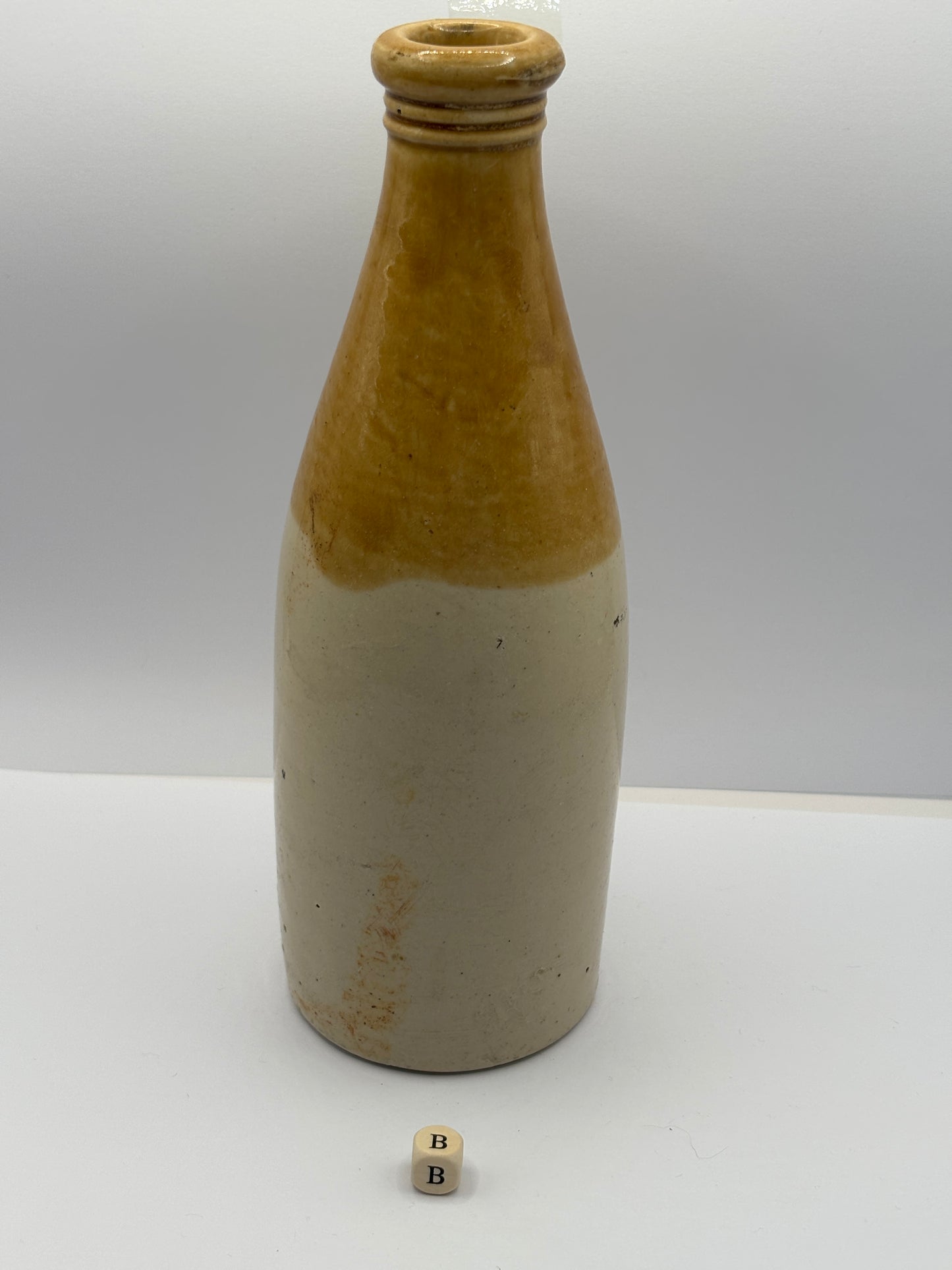 Old plain stoneware ginger beer bottle (B)