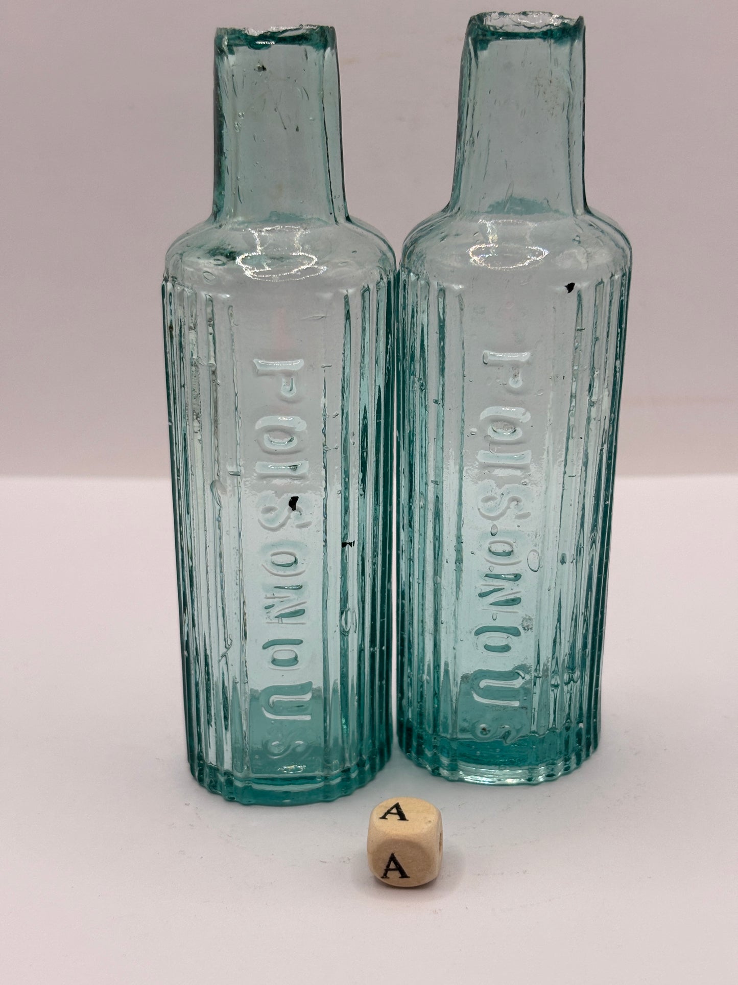 2 old aqua glass poison bottles, POISONOUS (a)