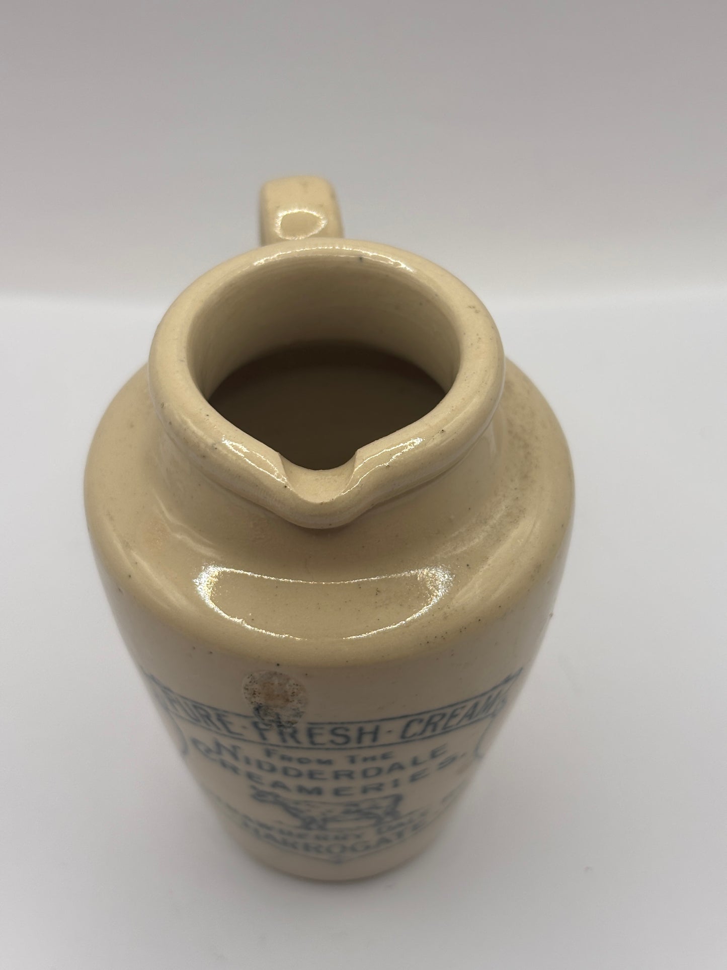 Old advertising cream pot, Nidderdale creameries. Pure fresh cream. Cow print