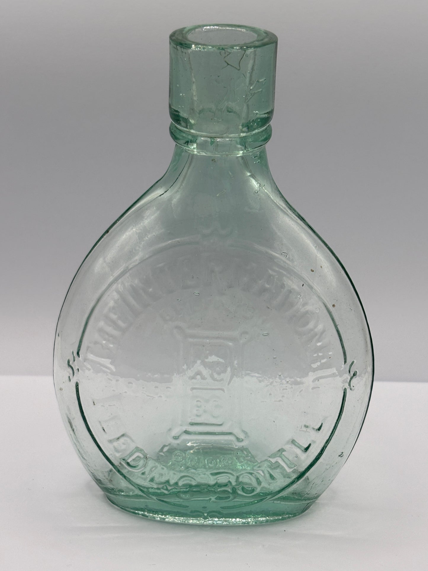 Old aqua glass baby feeder. The international feeder