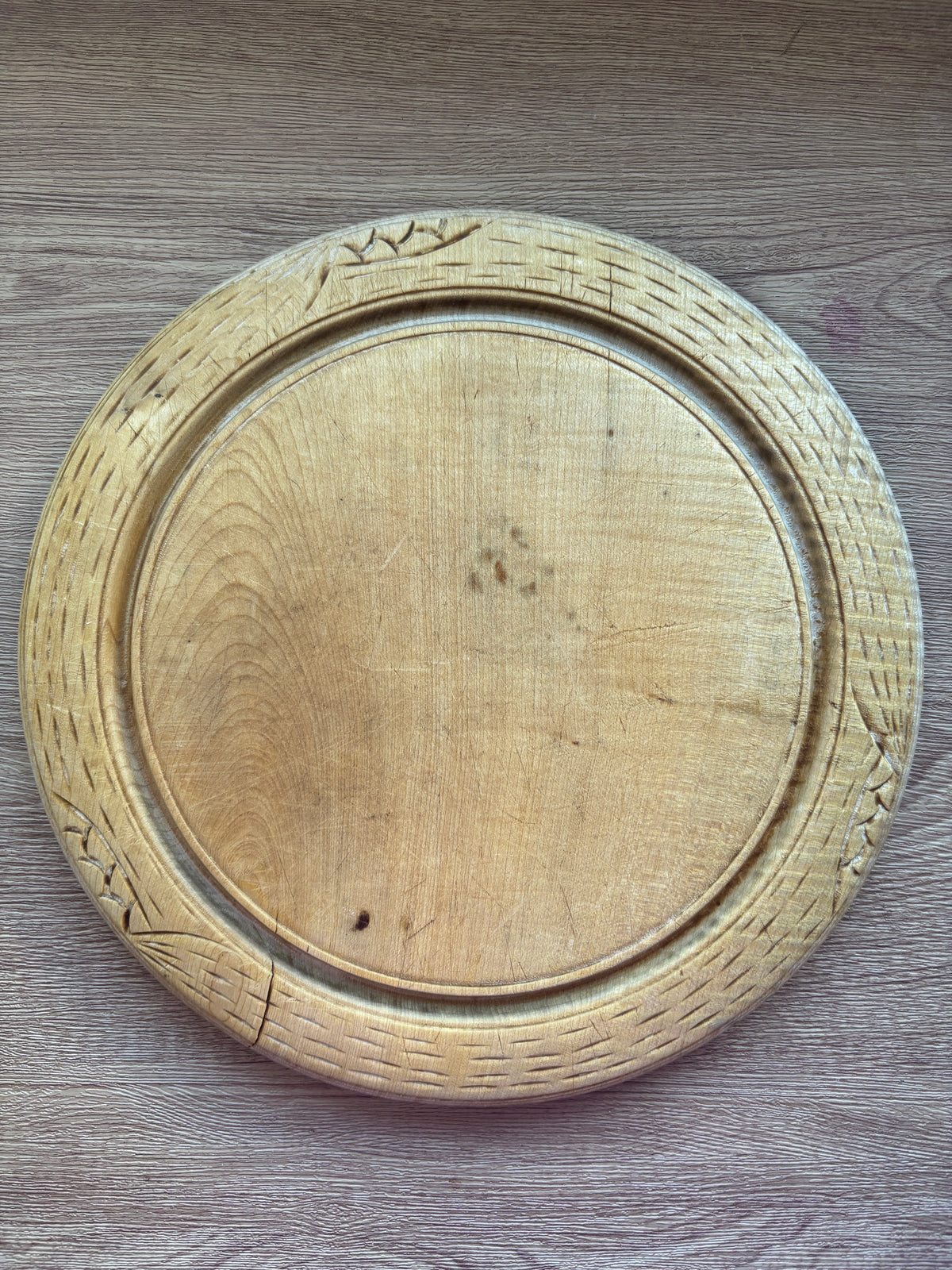 Old wooden carved bread board