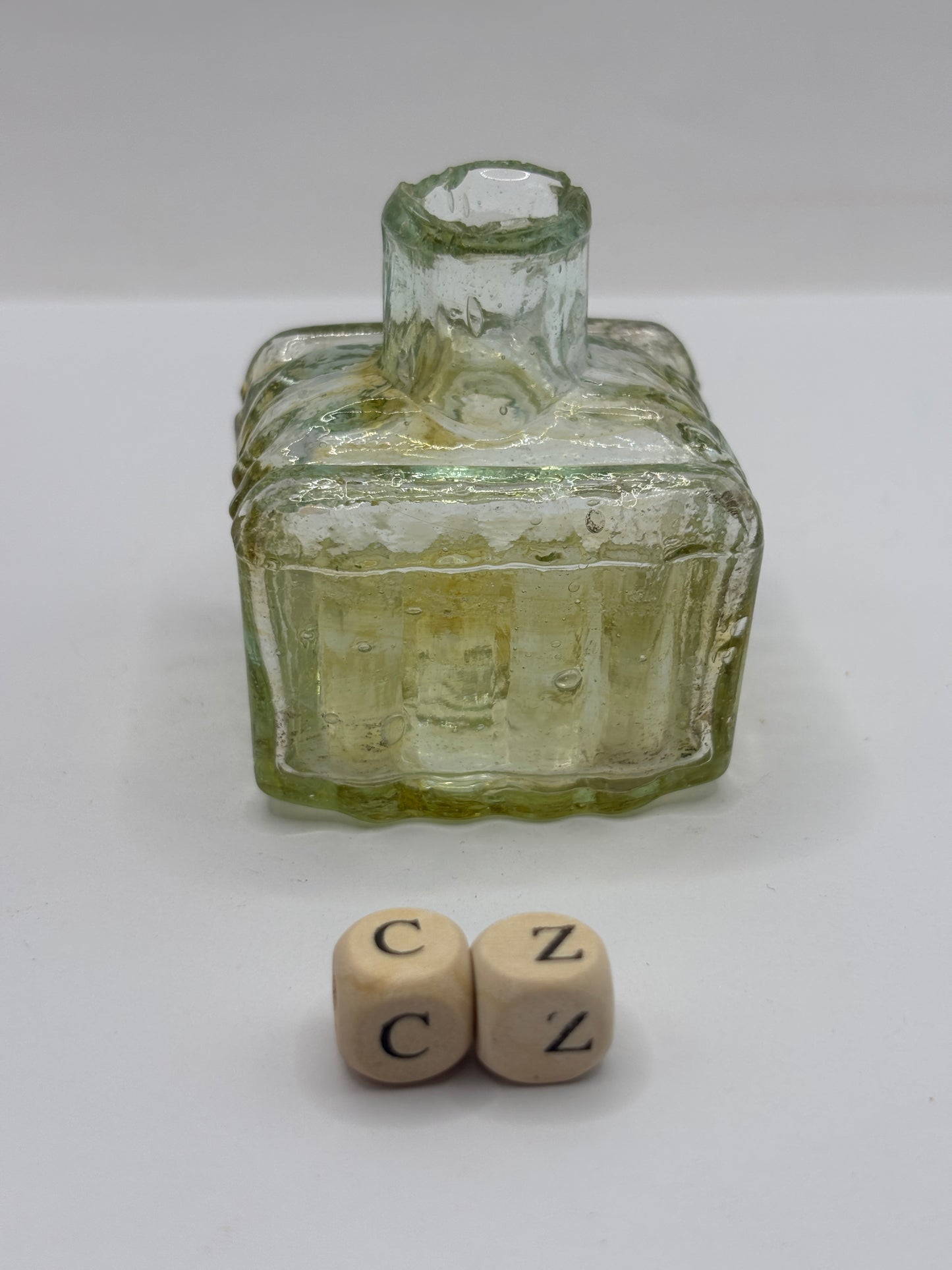 Old glass inkwell with swirls, penny ink, ink bottle (cz)