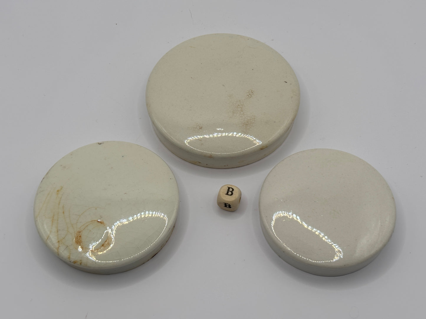 3 old plain stoneware lids (B)
