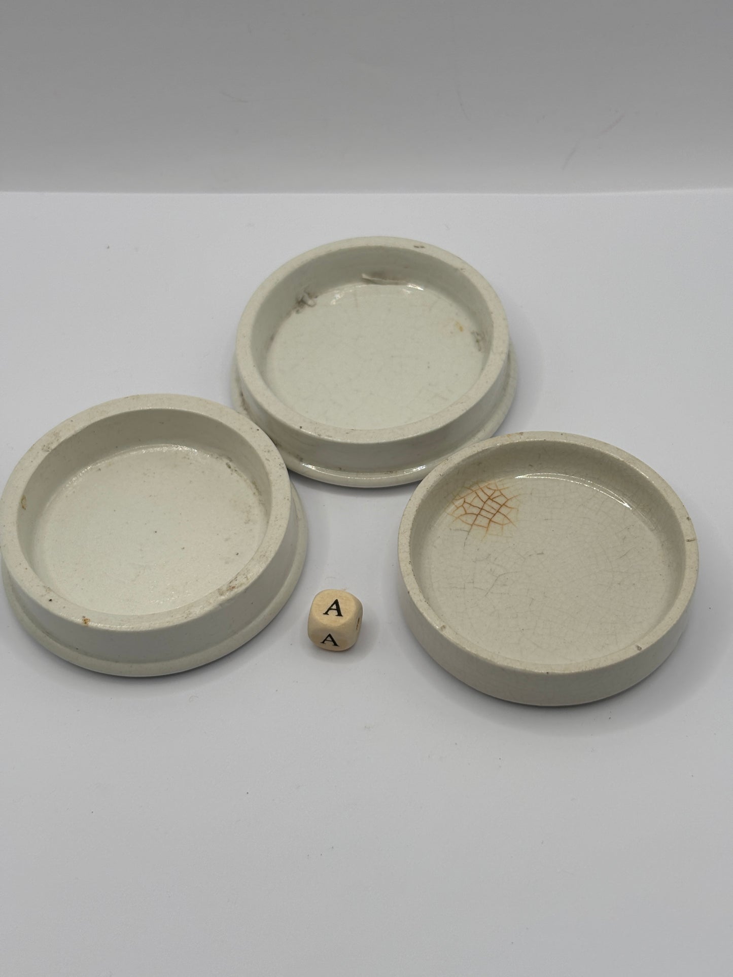 3 old plain stoneware lids (a)