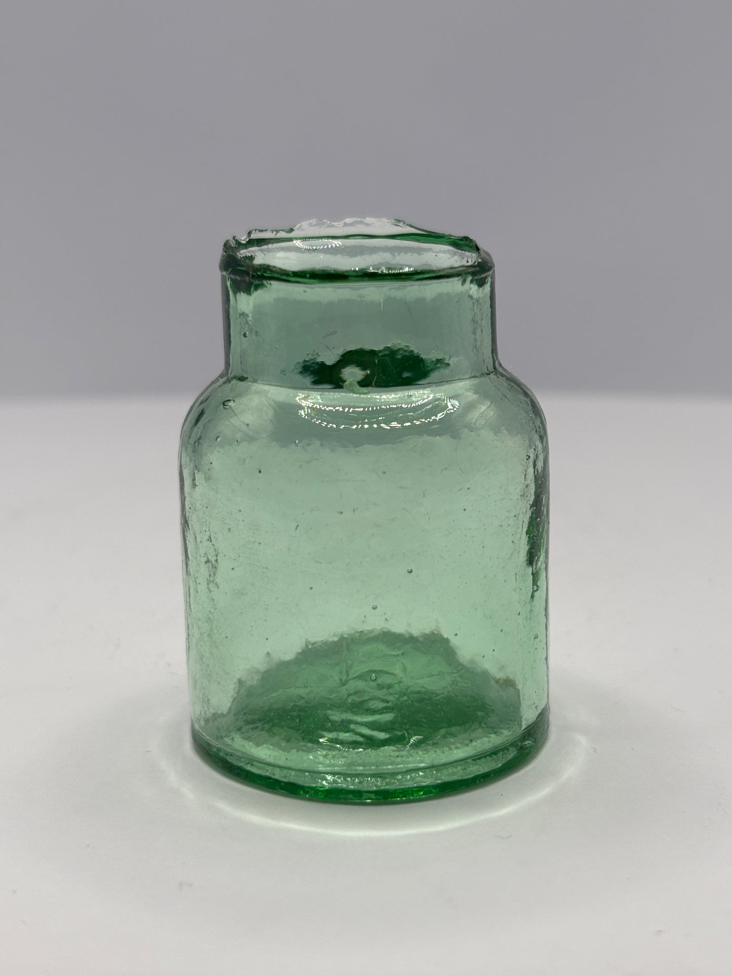 Old aqua glass rat paste bottle