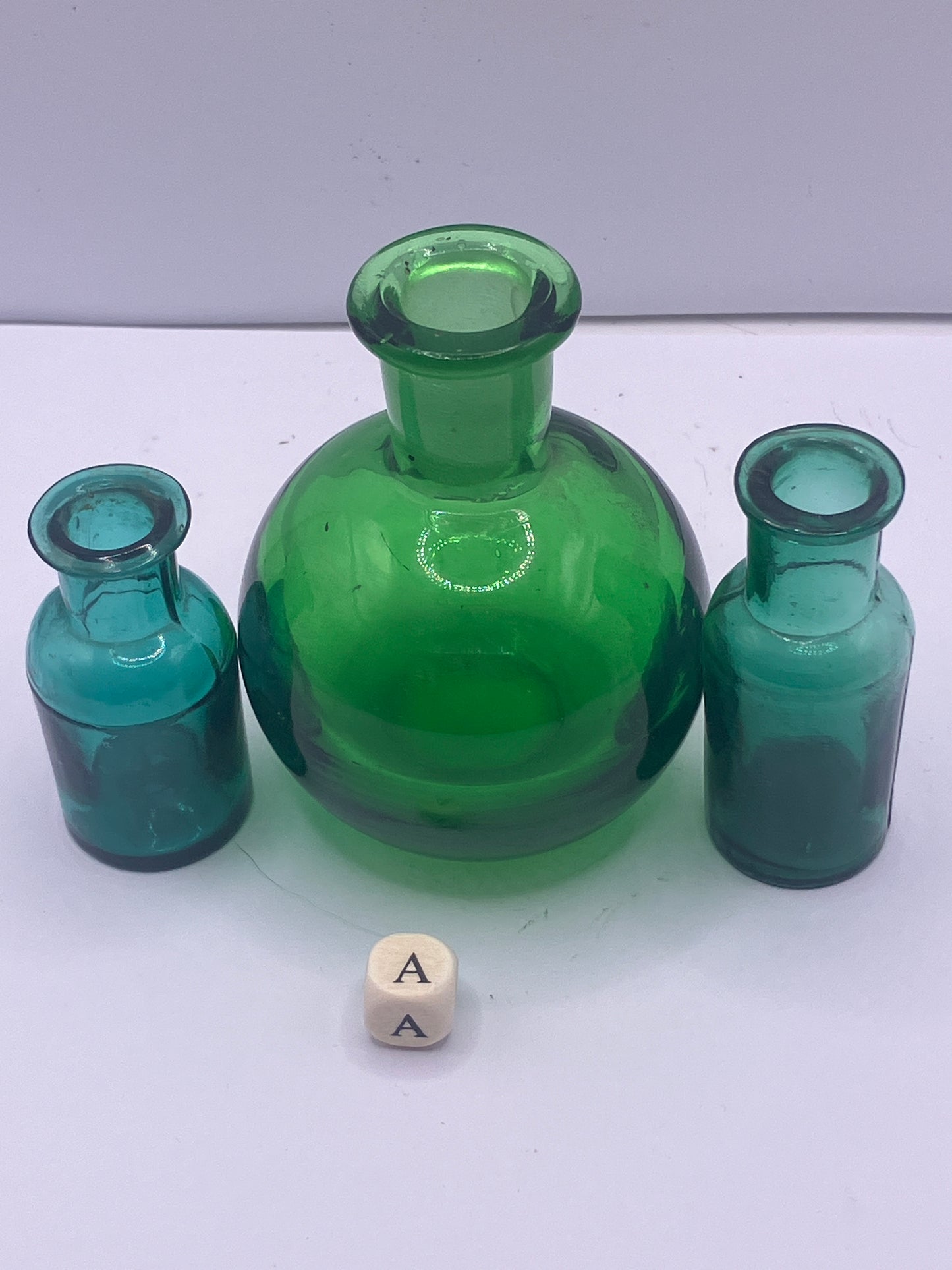 3 mini green glass bottles (a)