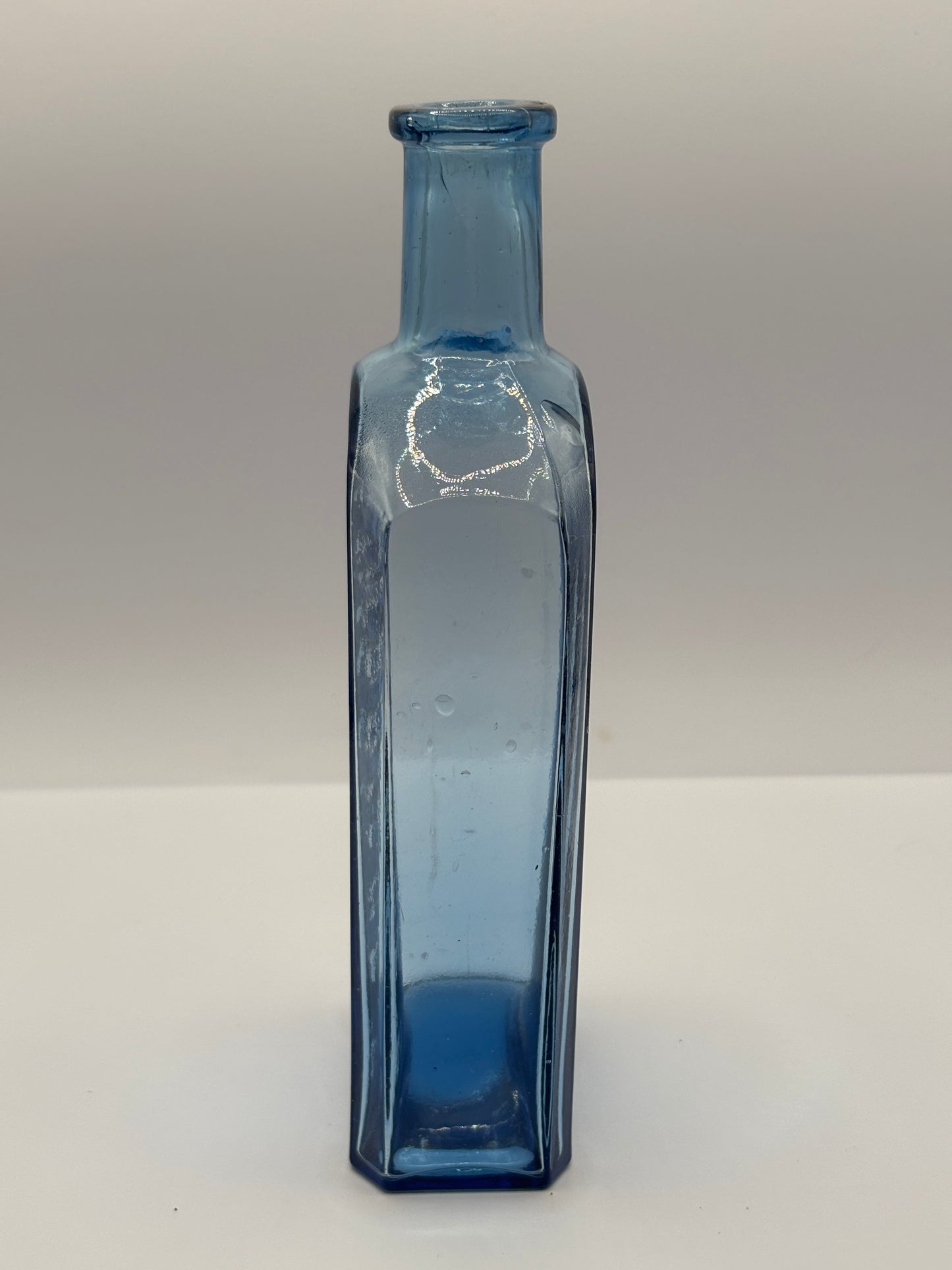 Old blue glass advertising chemist bottle, Owbridge Lung Tonic