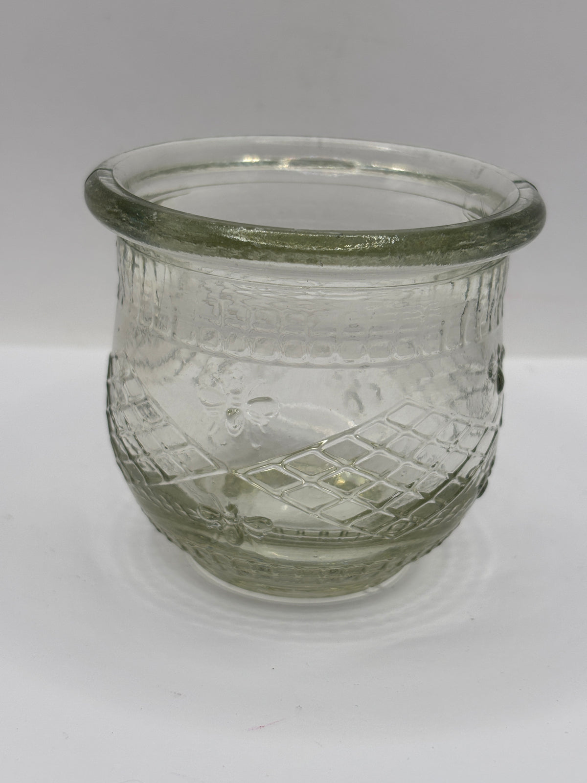 Old clear glass honey pot, honey bees