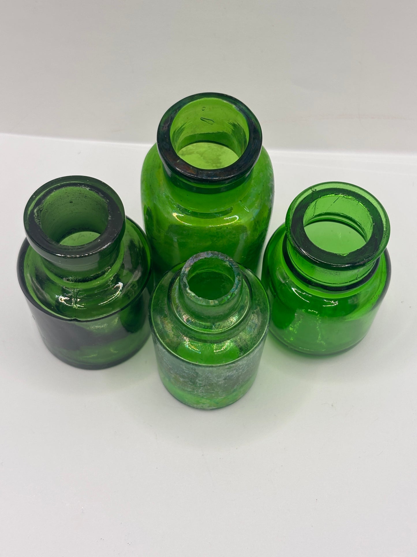 4 old green glass jars
