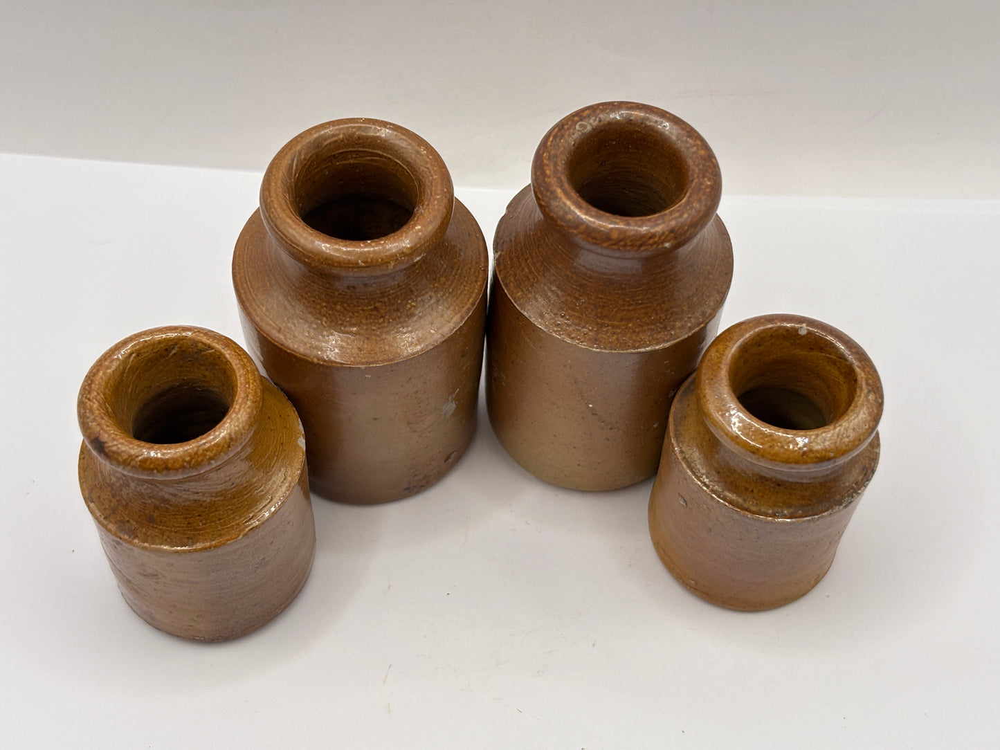 4 old small brown stoneware jars