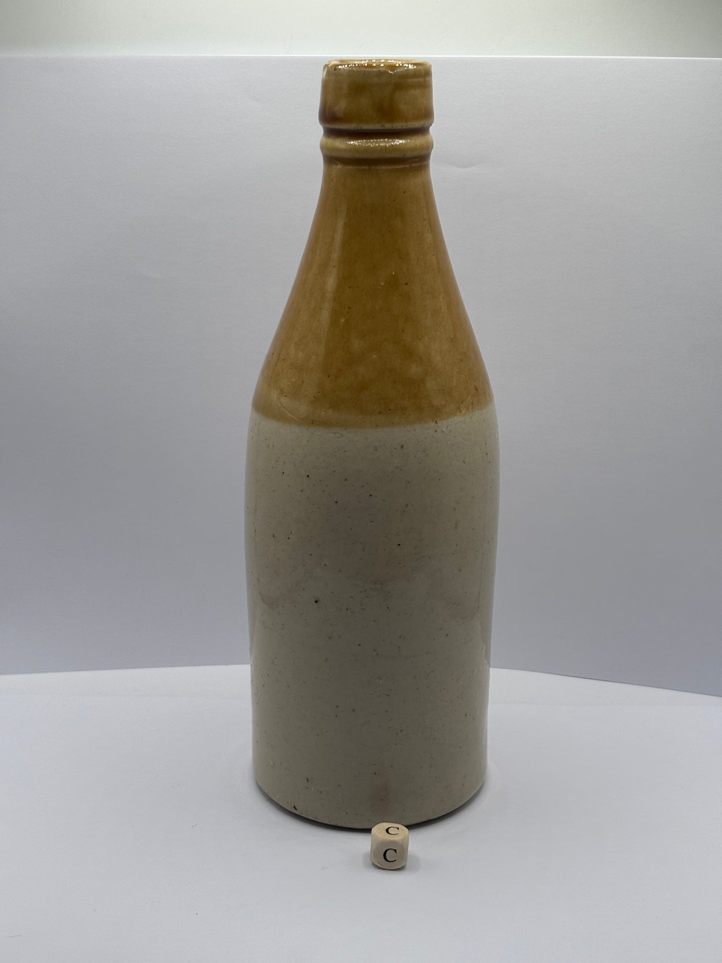 Old plain stoneware ginger beer bottle (c)