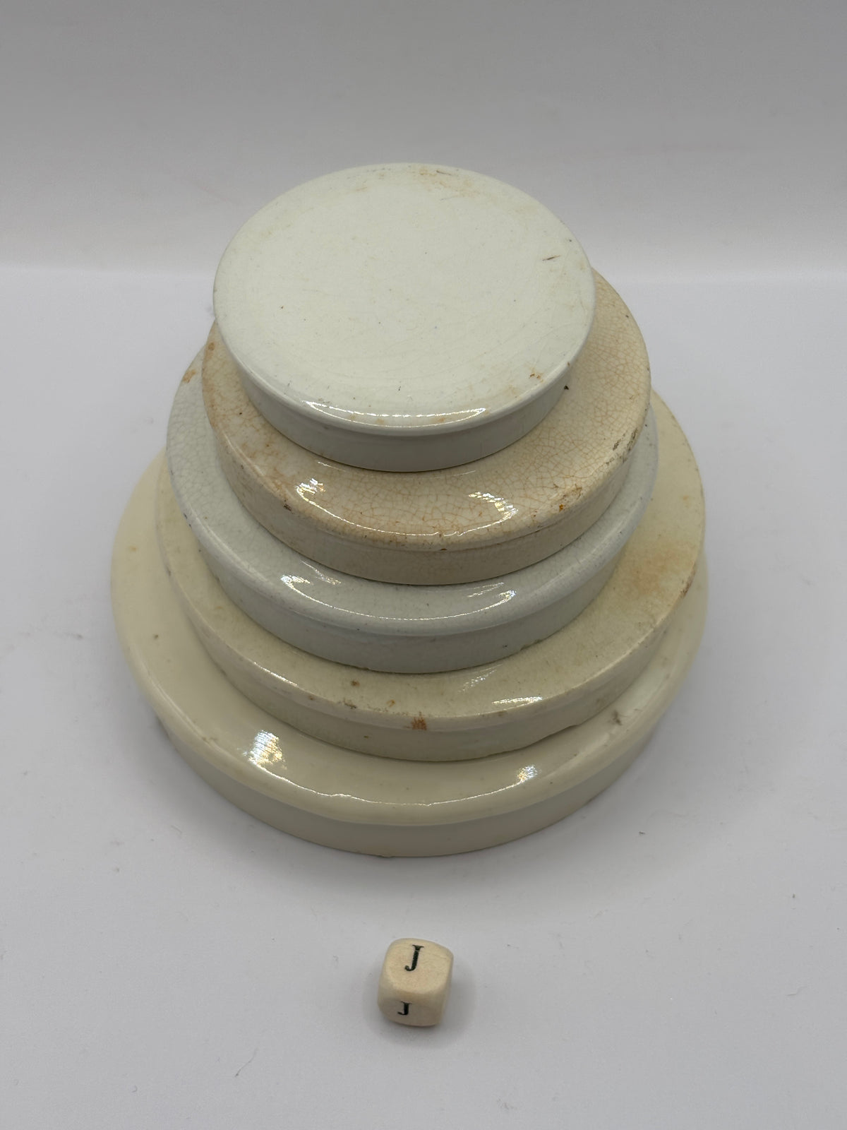 5 old stoneware lids, stackers (J)
