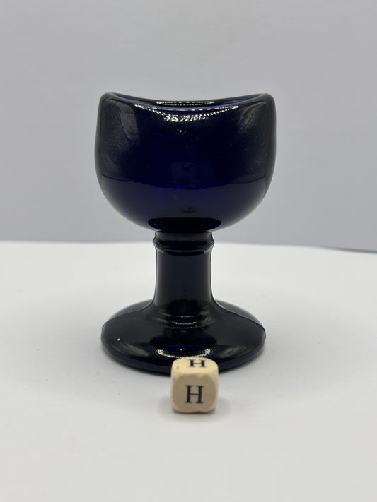 Old blue glass eye bath (H)