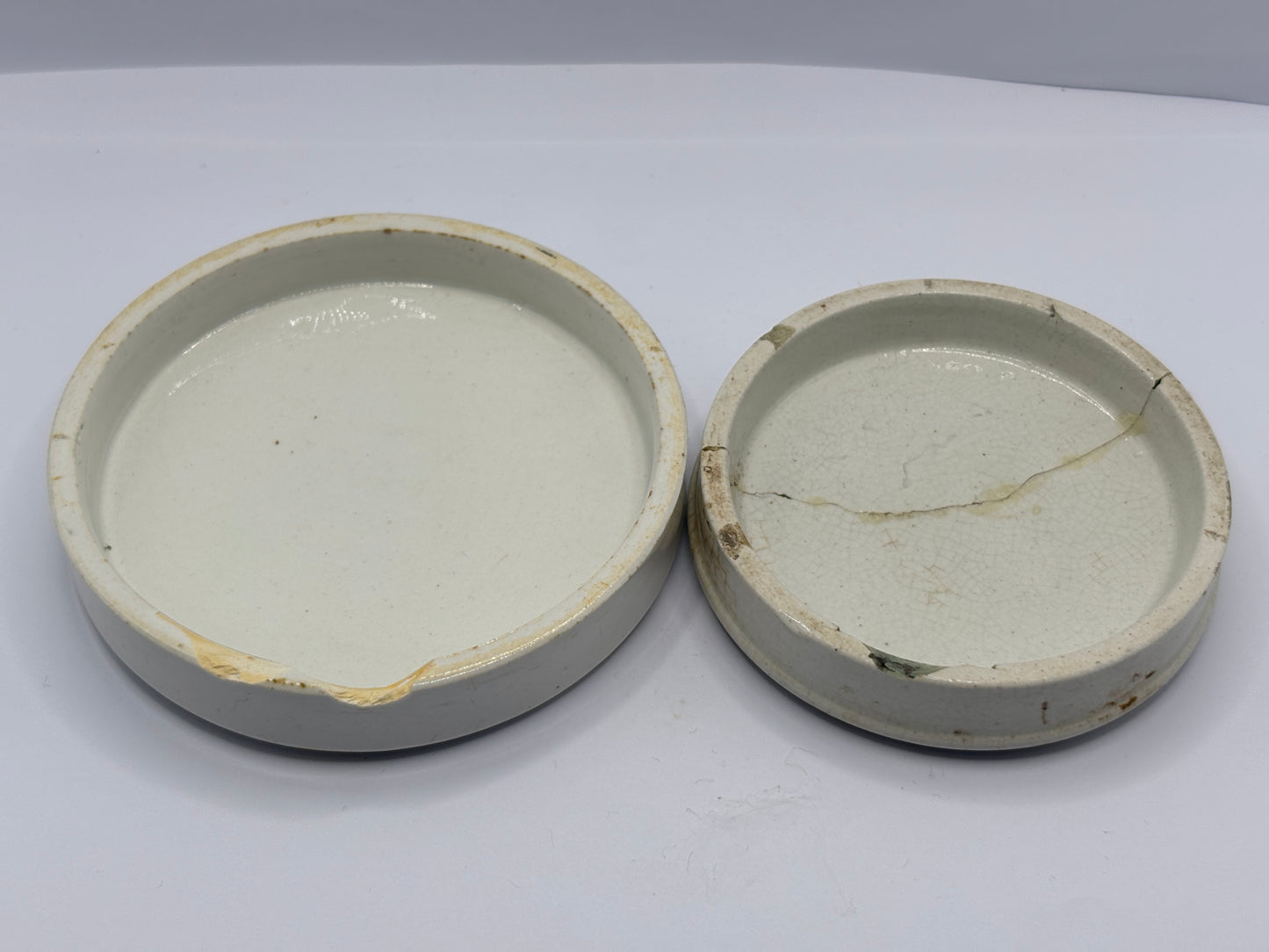 2 old damaged advertising lids