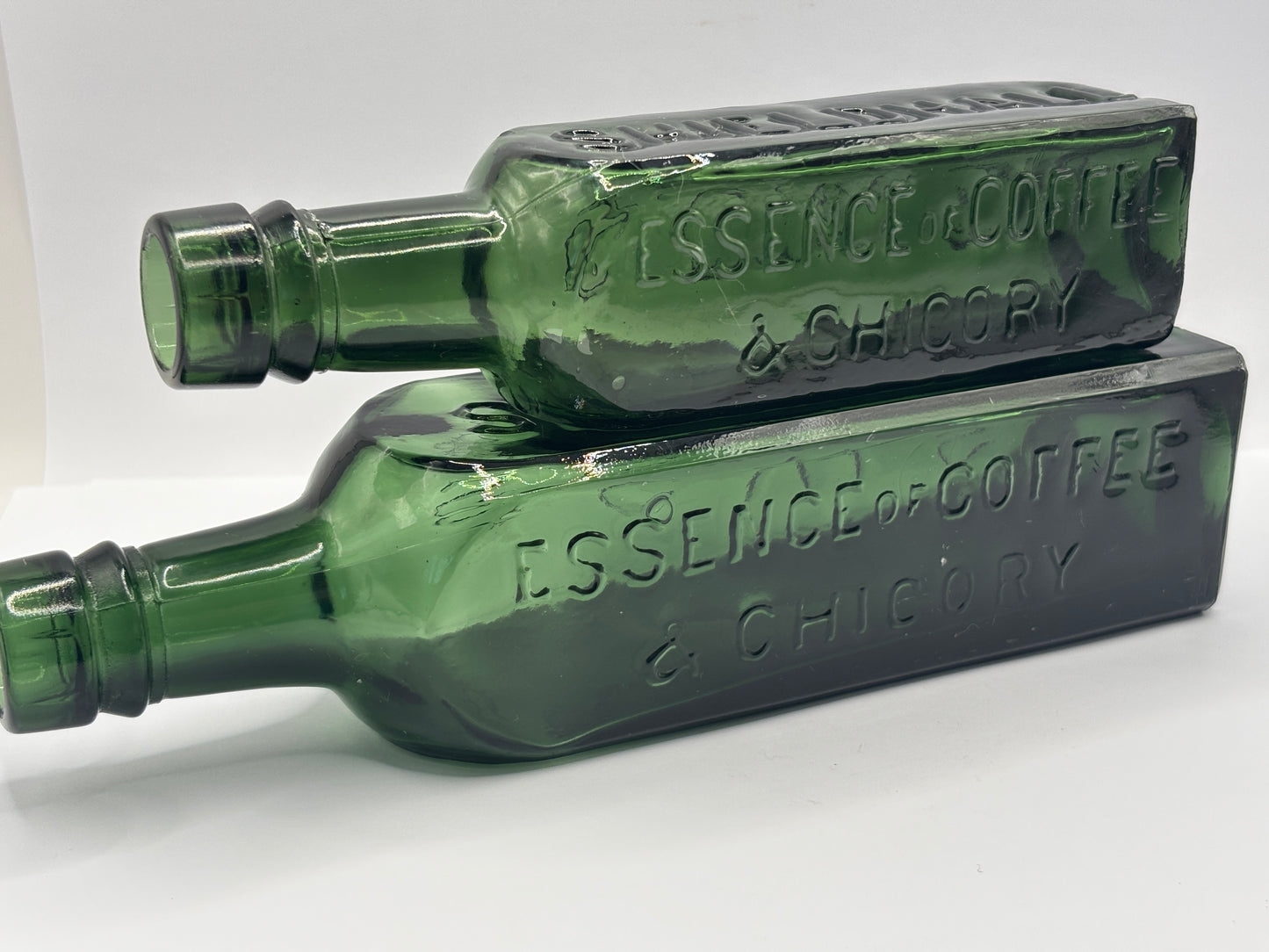 2 old dark green essence of coffee and chicory bottles