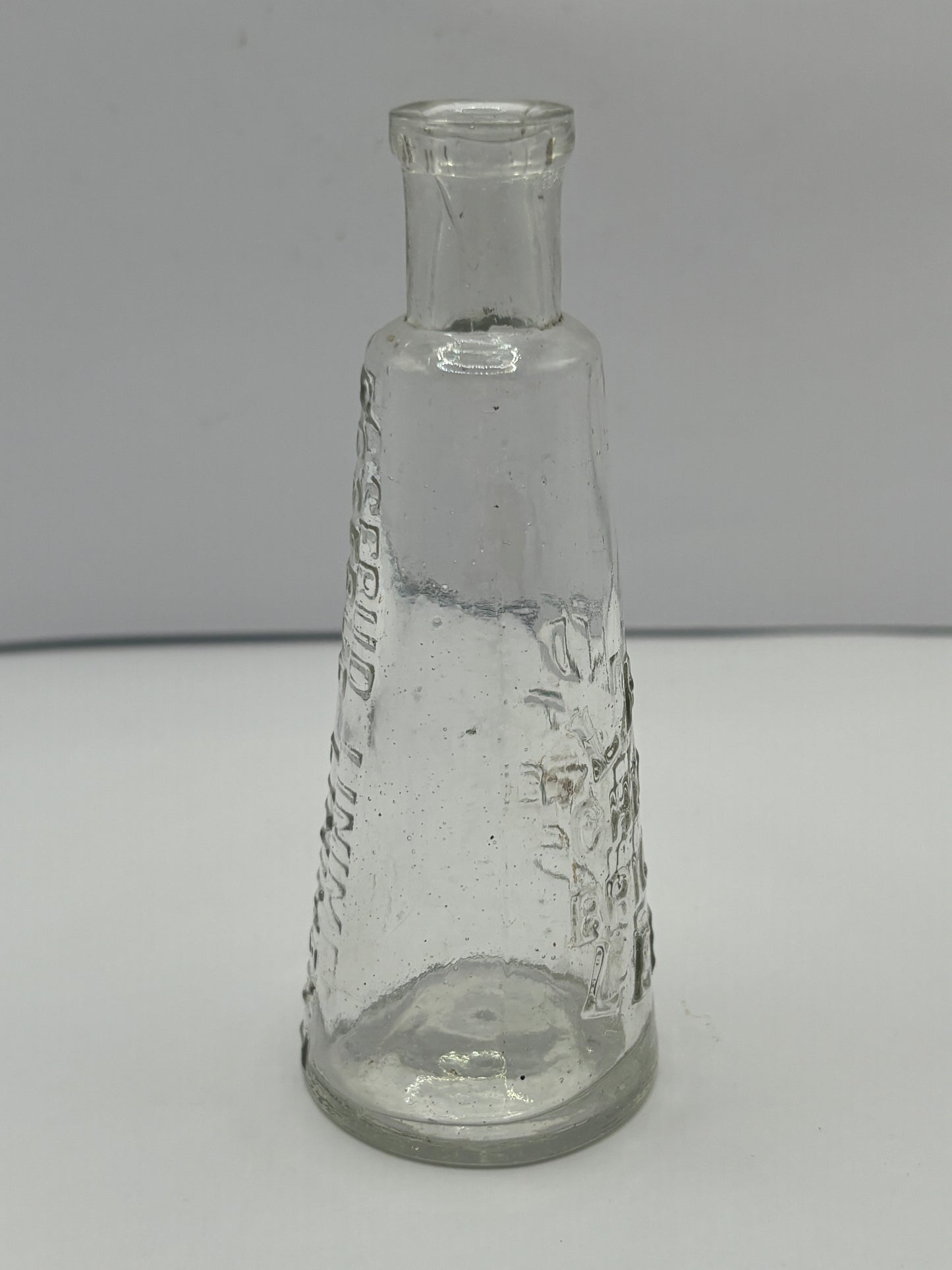 Old Leeds Rosebud liniment advertising bottle, Land chemist Briggate Leeds