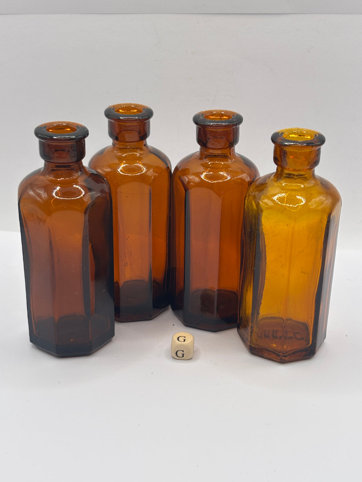 4 Old amber glass medicine bottles (G)