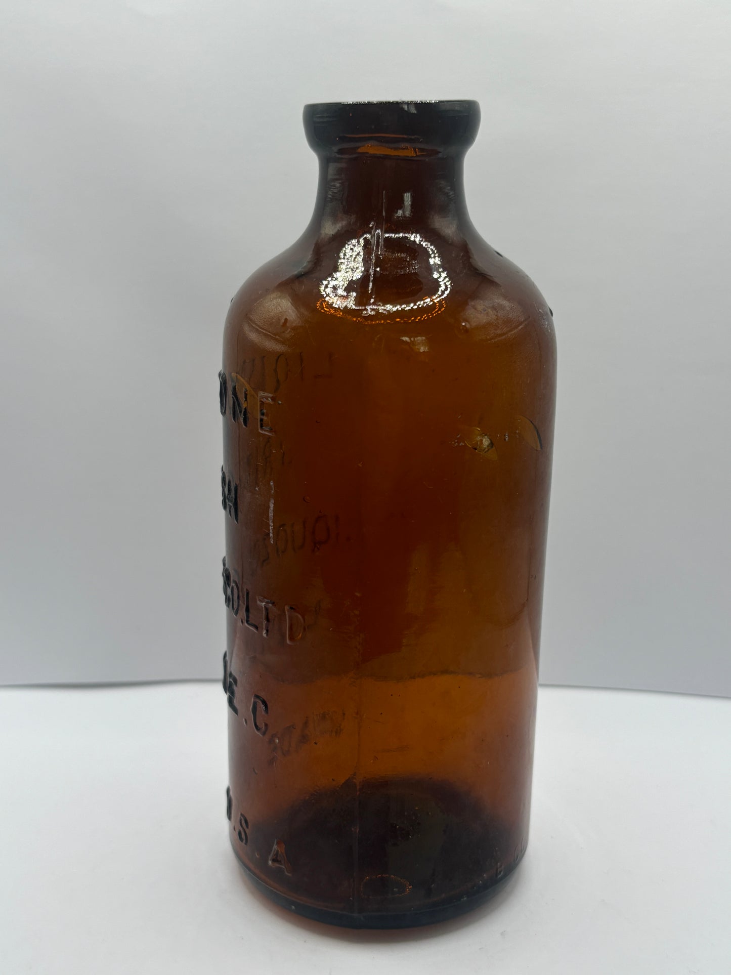 old amber glass liquozone bottle