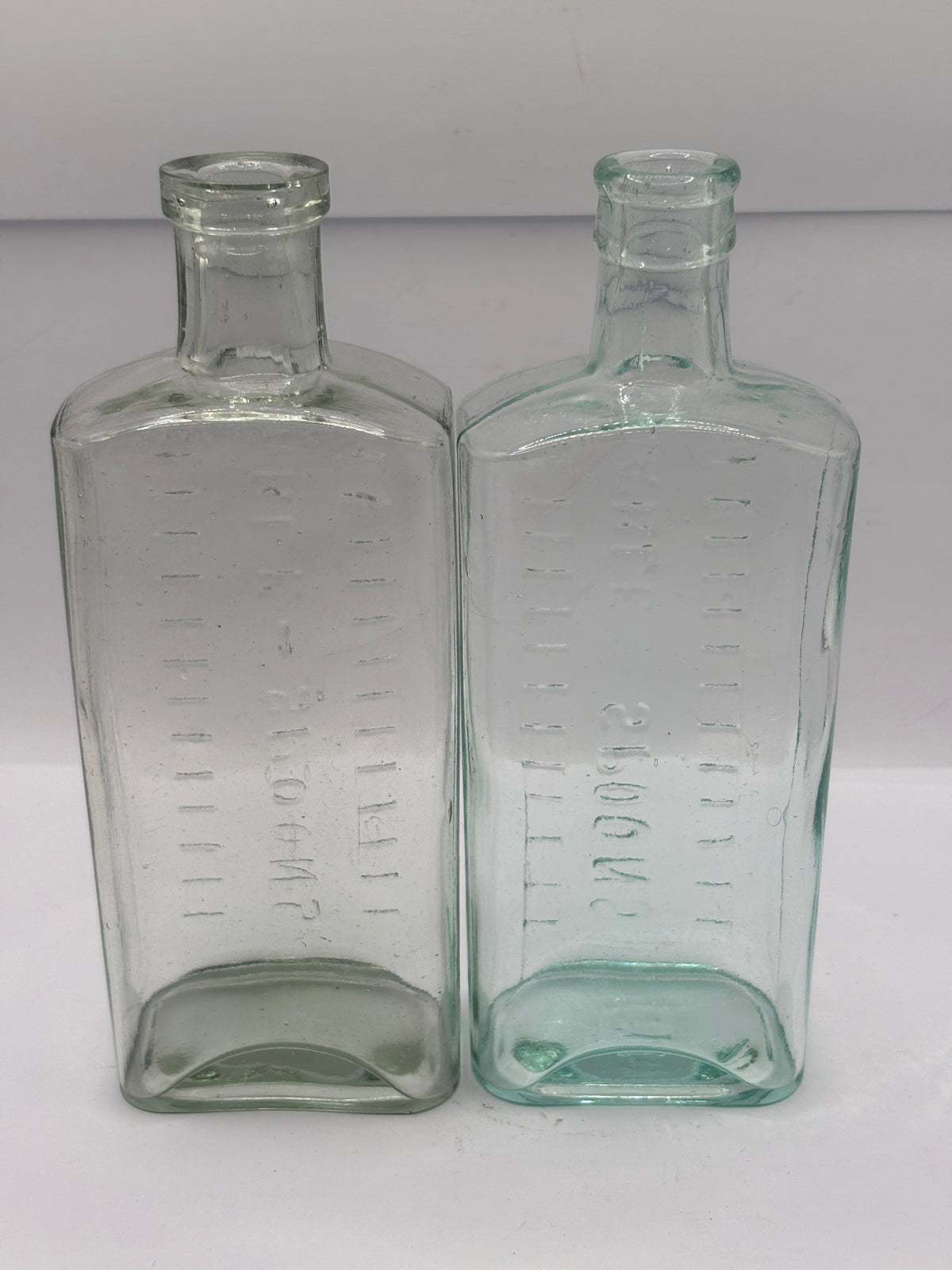 2 old aqua glass medicine bottles, table spoons