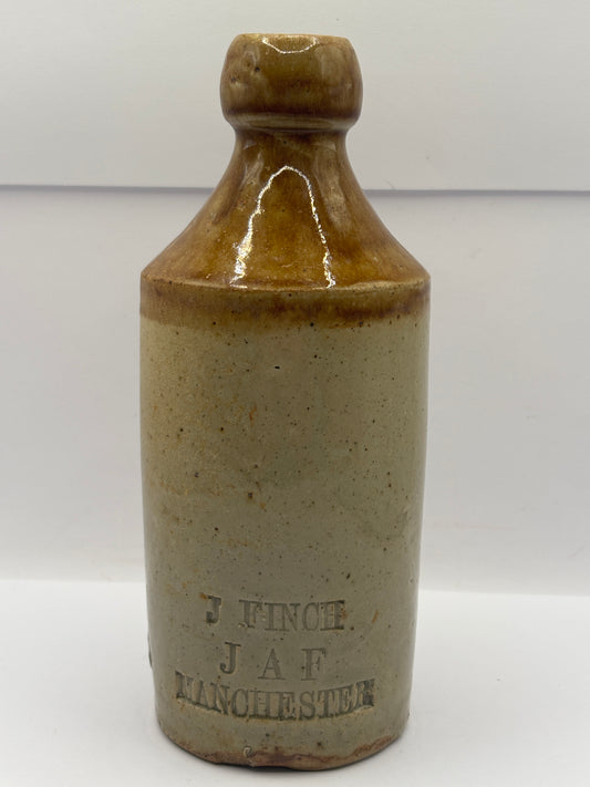 Old impressed stoneware ginger beer bottle, Manchester. J.Finch