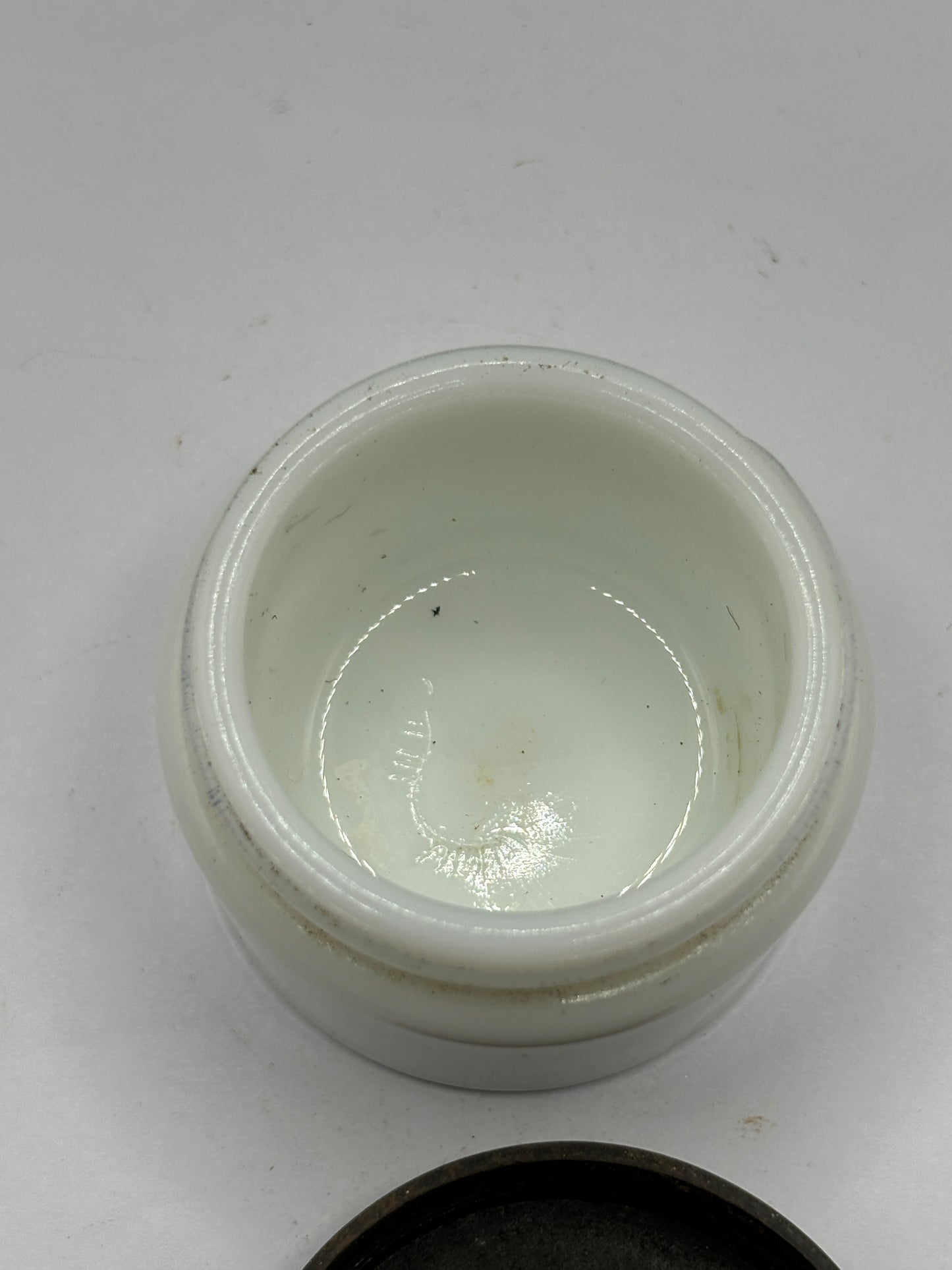 Small milk glass jar with original lid