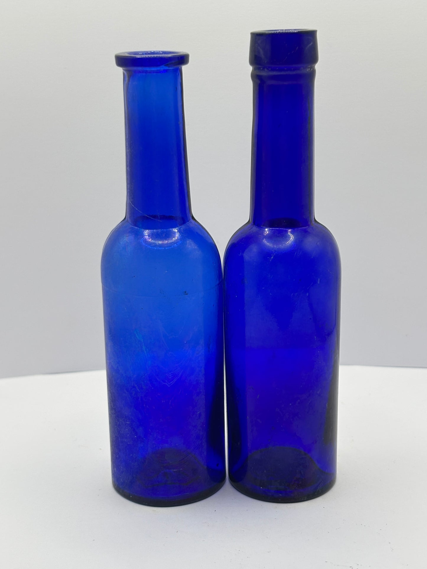 2 old blue castor oil bottles