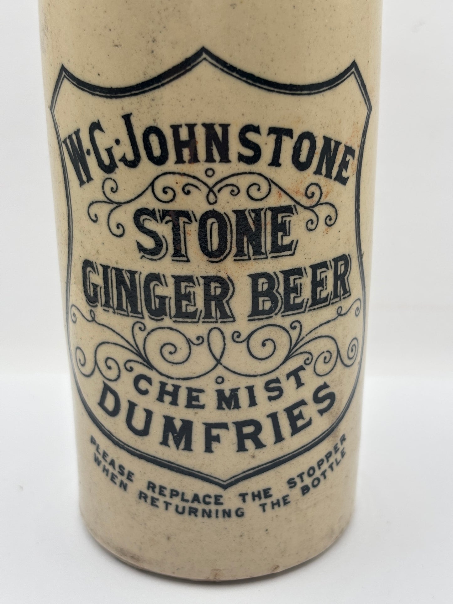 Old stoneware ginger beer bottle, W.G Johnstone chemists Dumfries