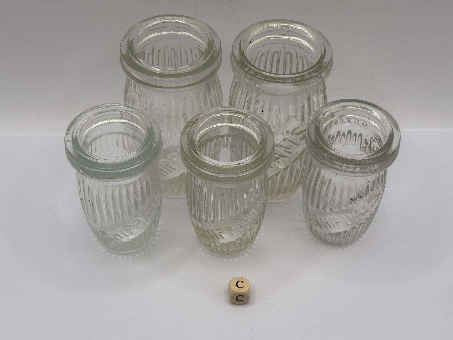 5 old clear glass meat paste jars (c)