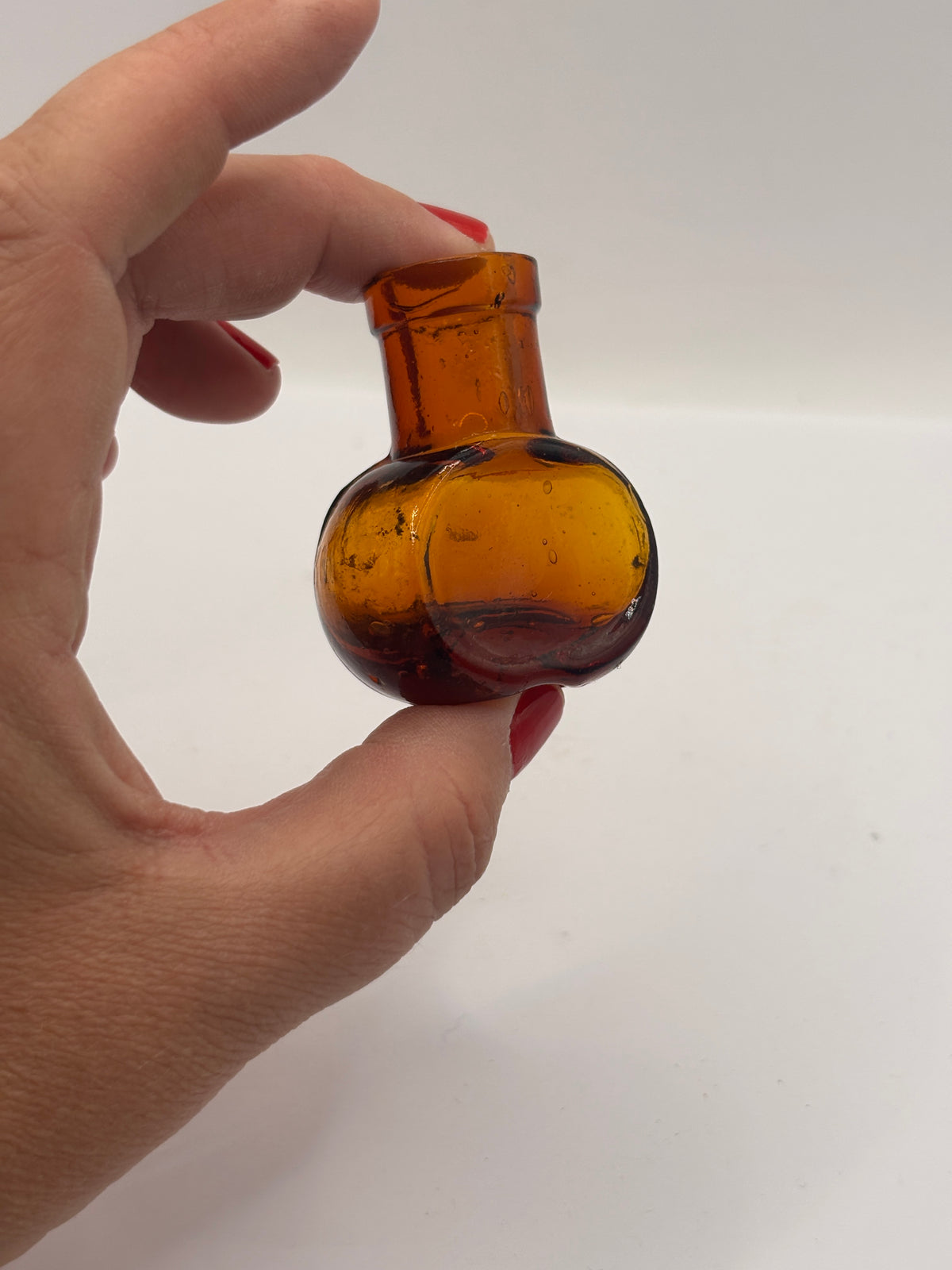 Old mini 1oz amber glass advertising Bovril bottle