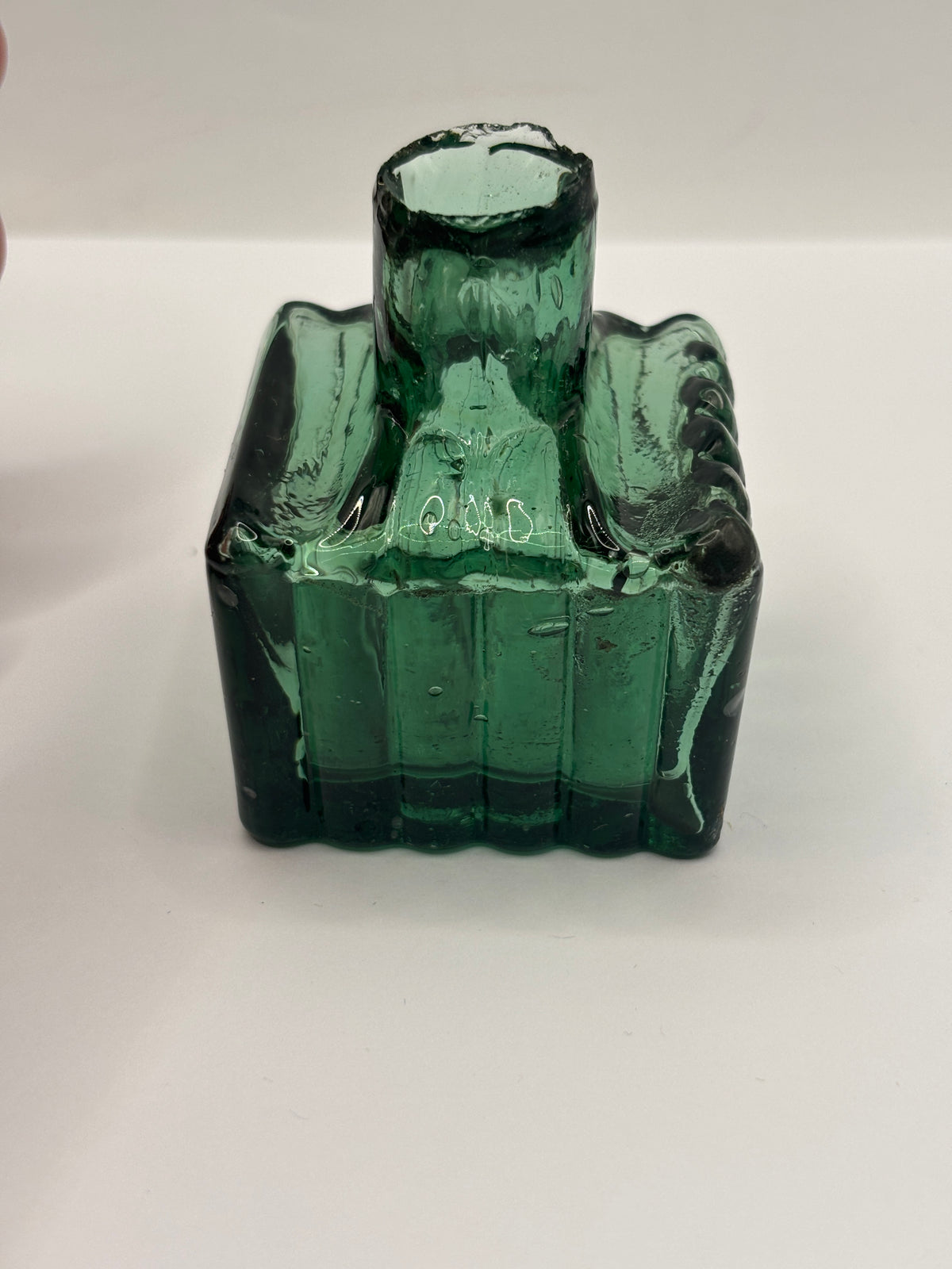 Old dark green glass inkwell, ink bottle, penny ink