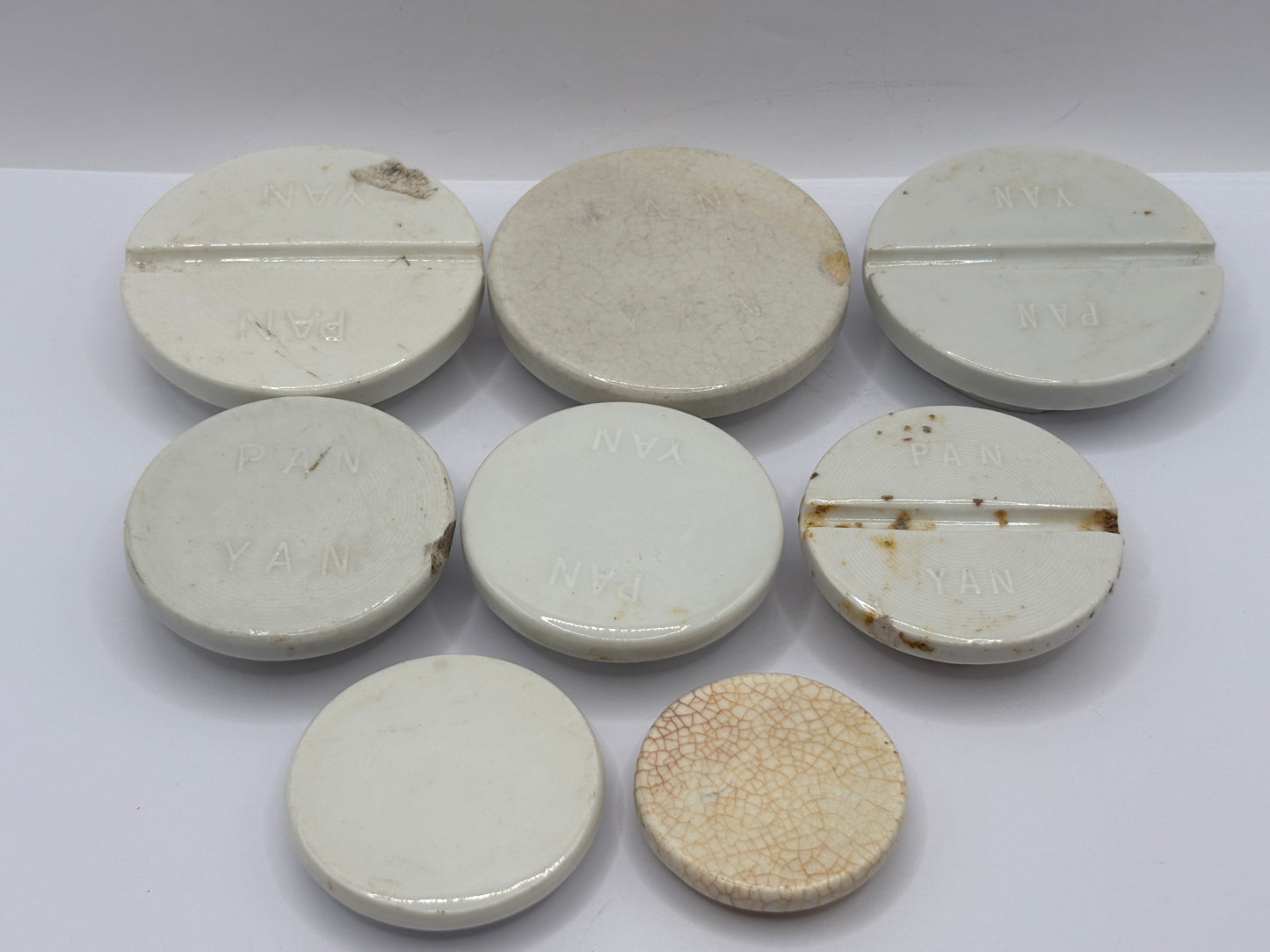 8 stoneware lids, stacking lids. Damaged