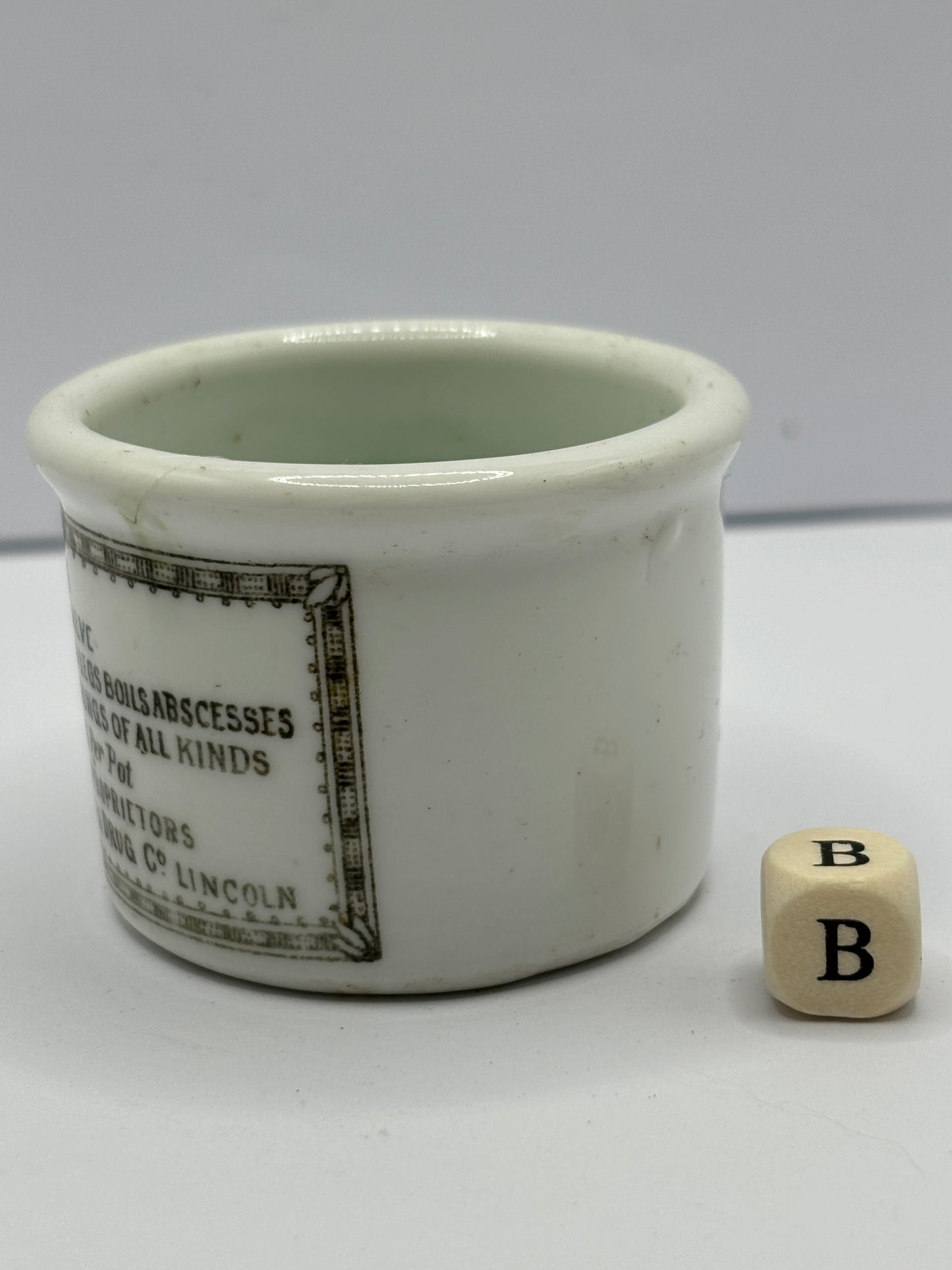 Small Clarke’s miraculous salve advertising ointment pot (b)