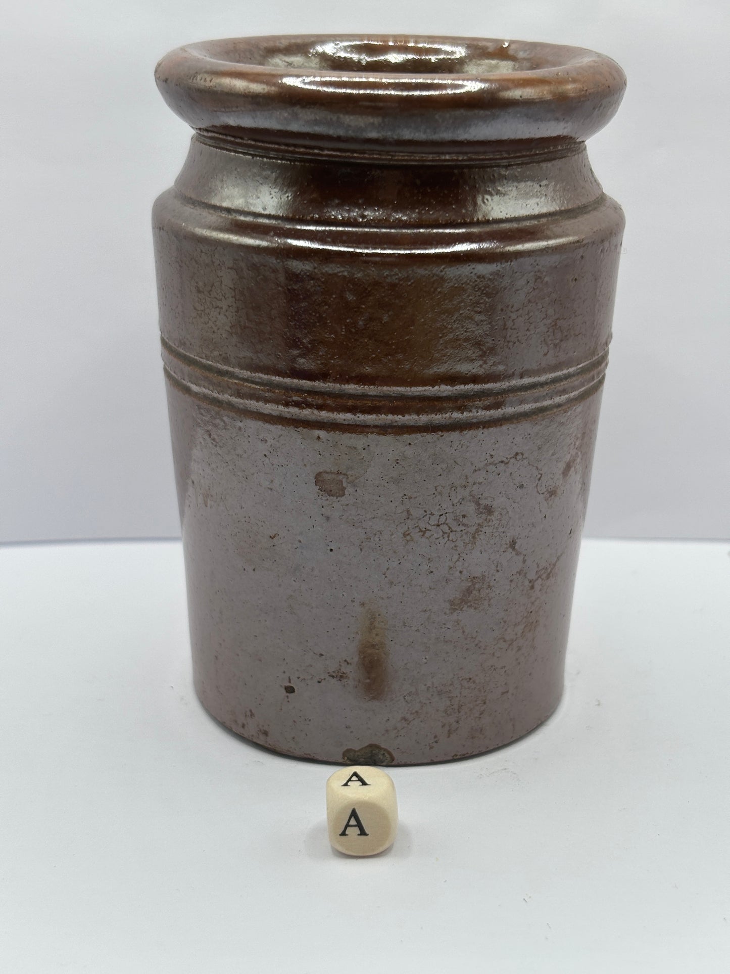 Old brown stoneware jar (a)