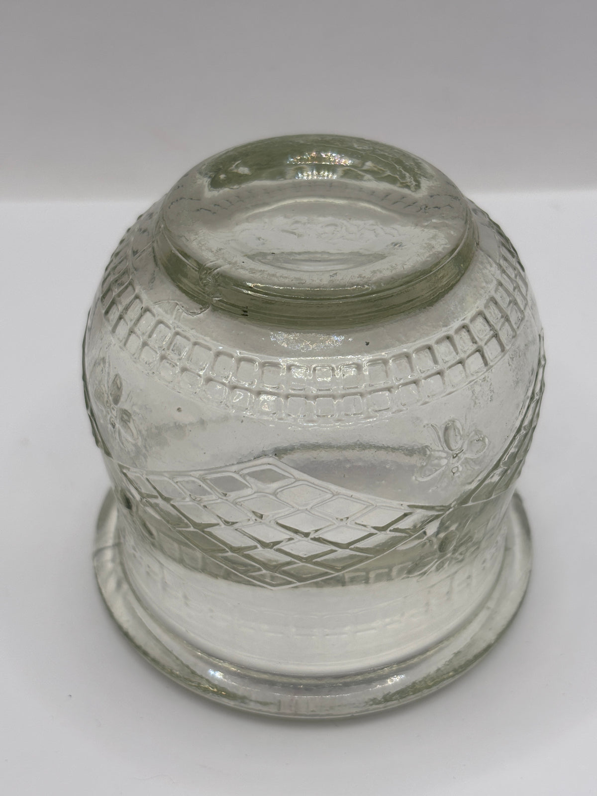 Old clear glass honey pot, honey bees
