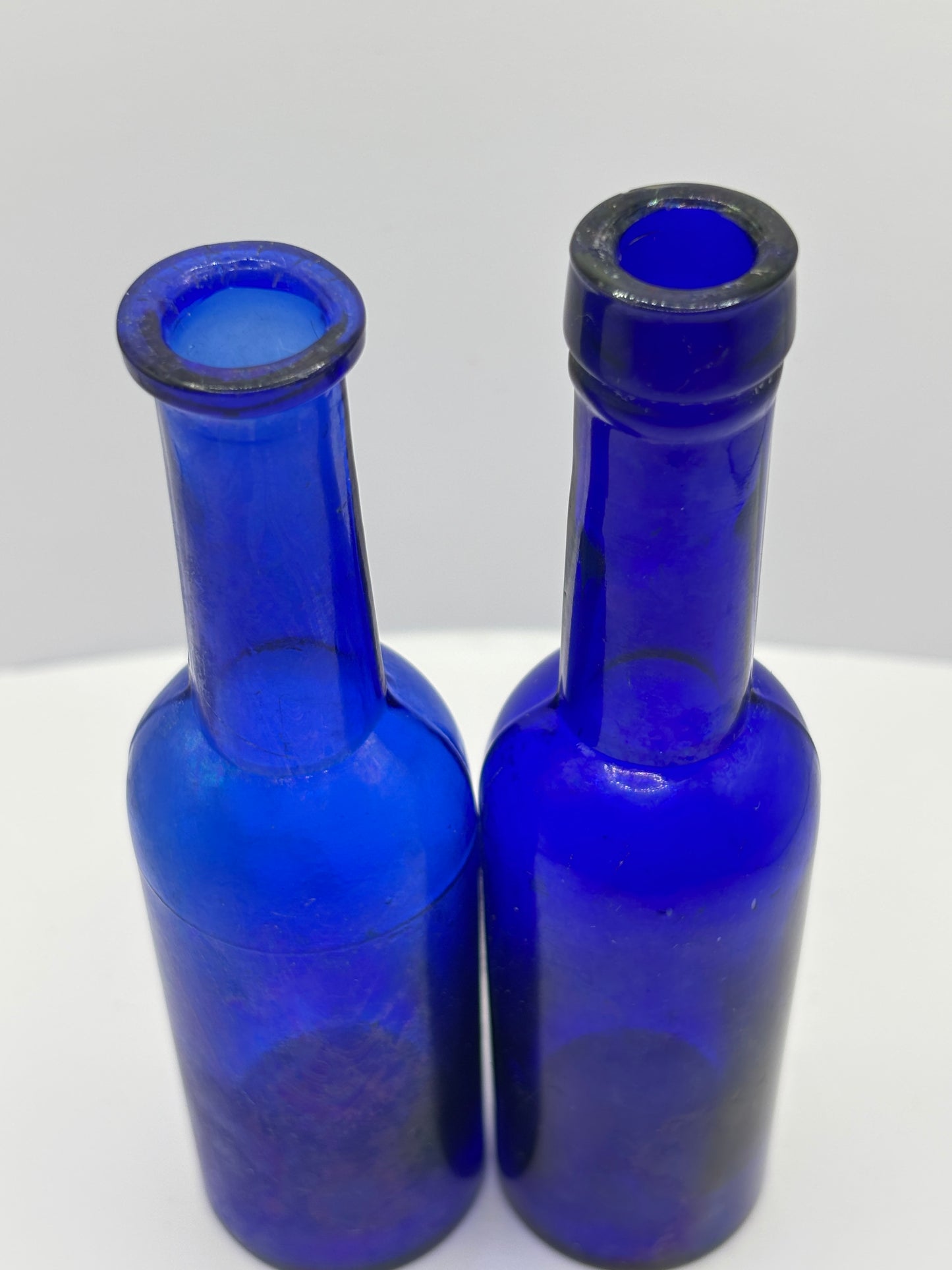2 old blue castor oil bottles