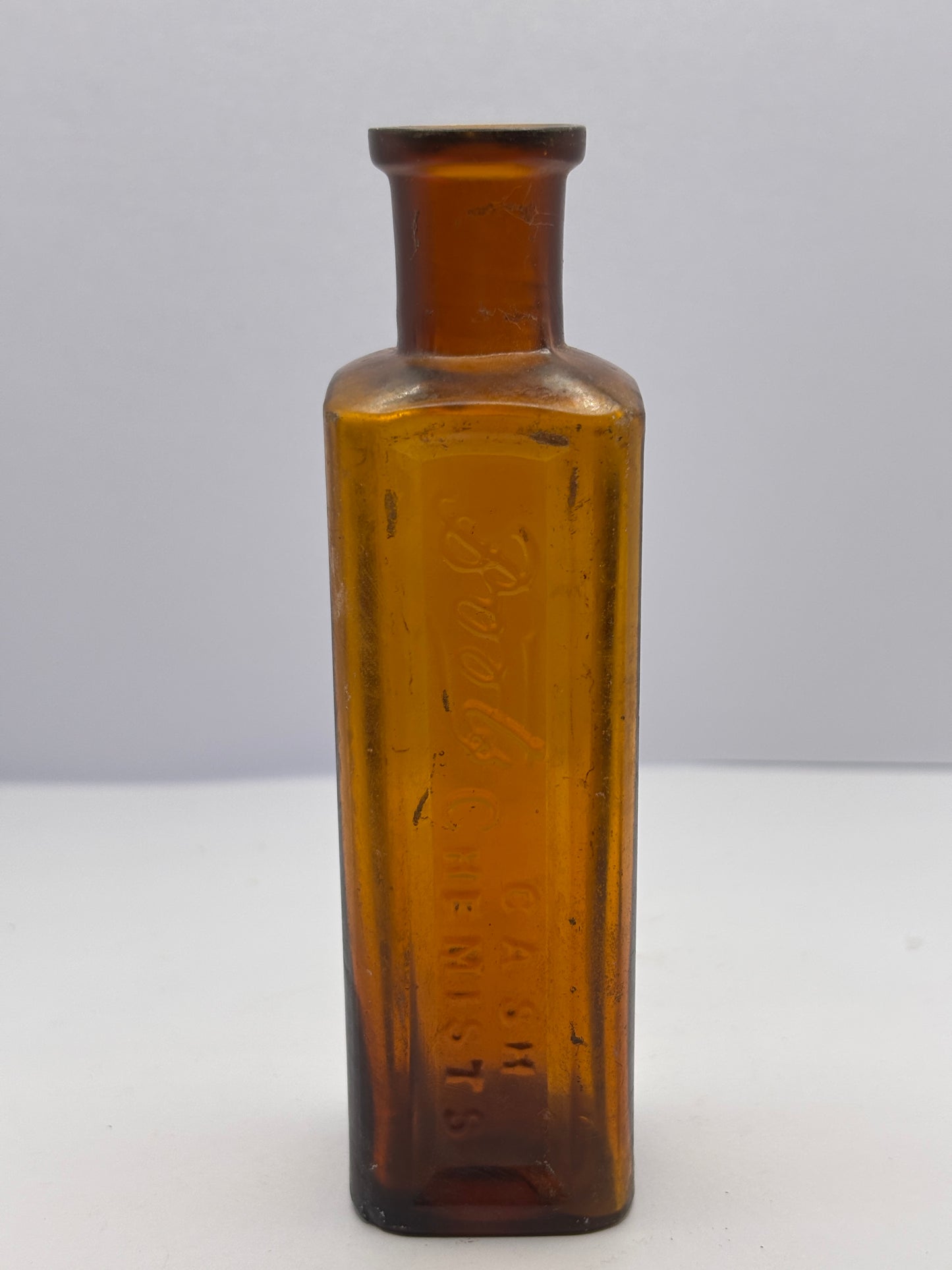 Old amber glass Boots cash chemists bottle