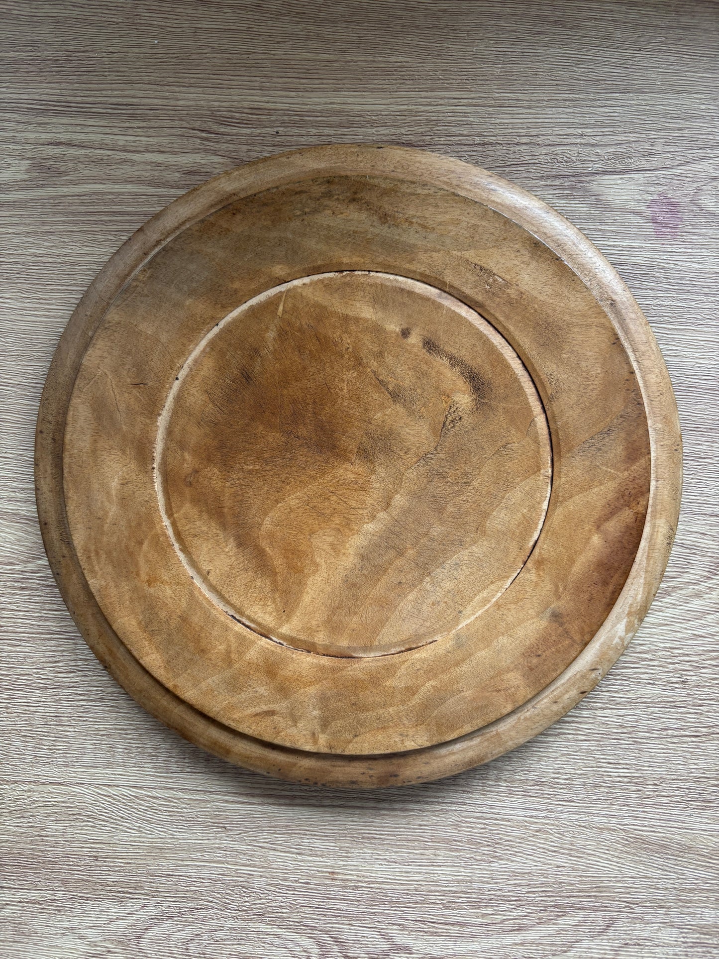 Old wooden carved bread board