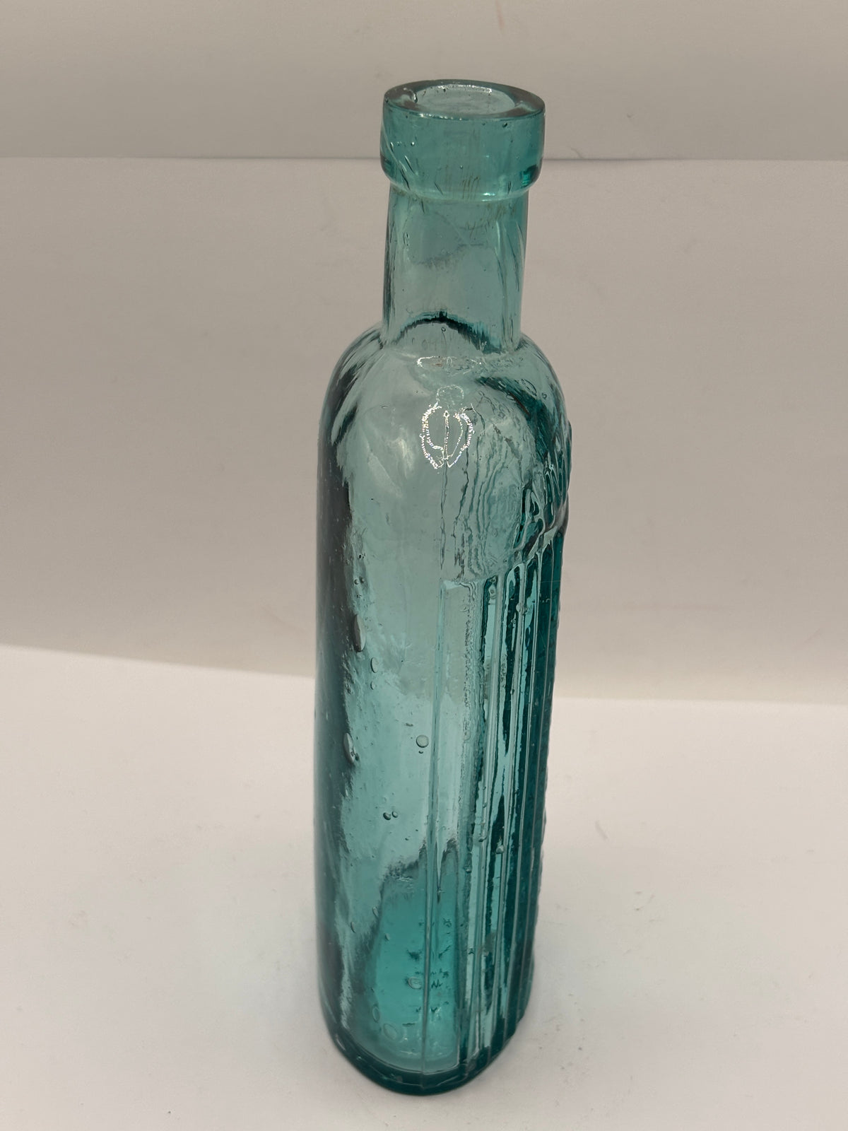 Old aqua glass poison bottle, ammonia, POISONOUS not to be taken
