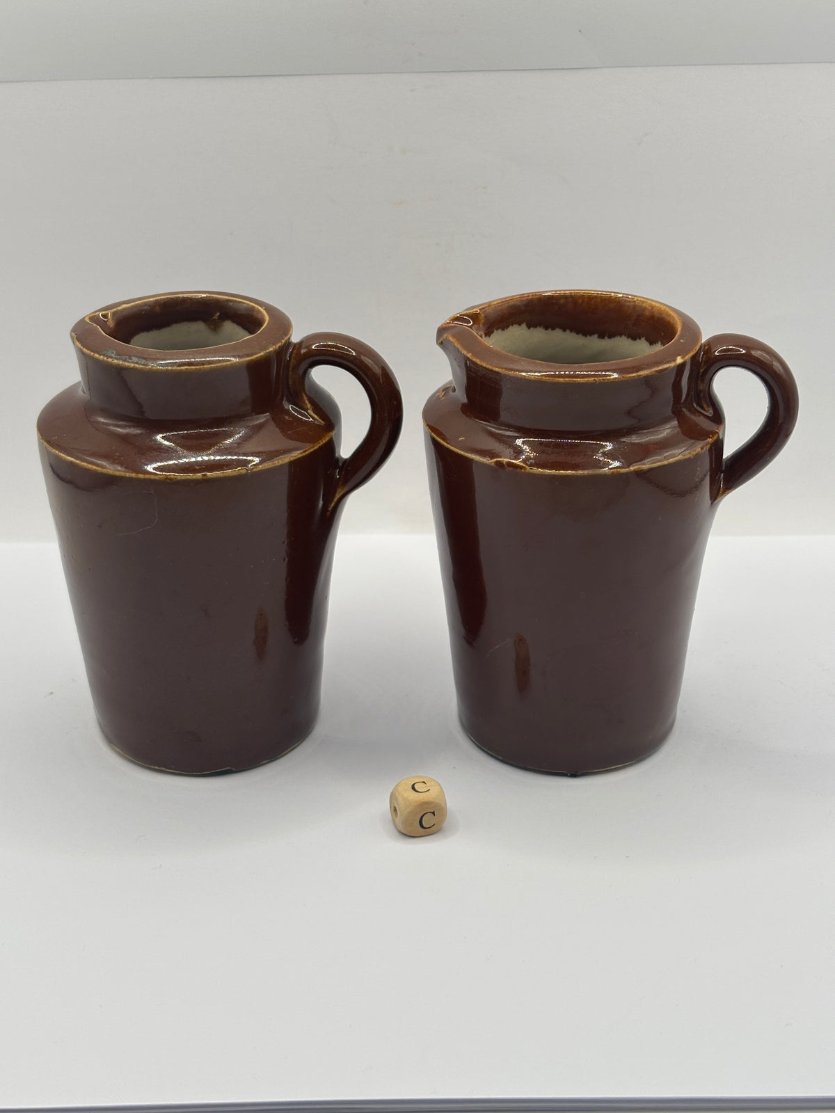 2 Old brown stoneware cream pots (C)