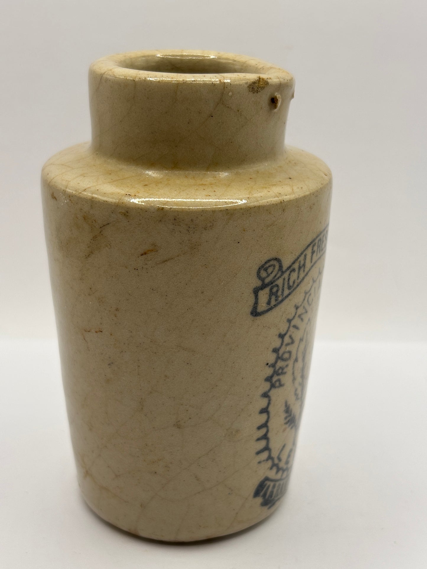 Old stoneware advertising cream pot. Provencial dairies Leeds