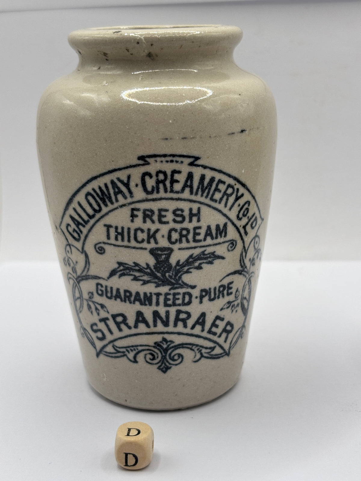 Old advertising cream pot, Galloway creamery Stranraer. Lip chip (D)
