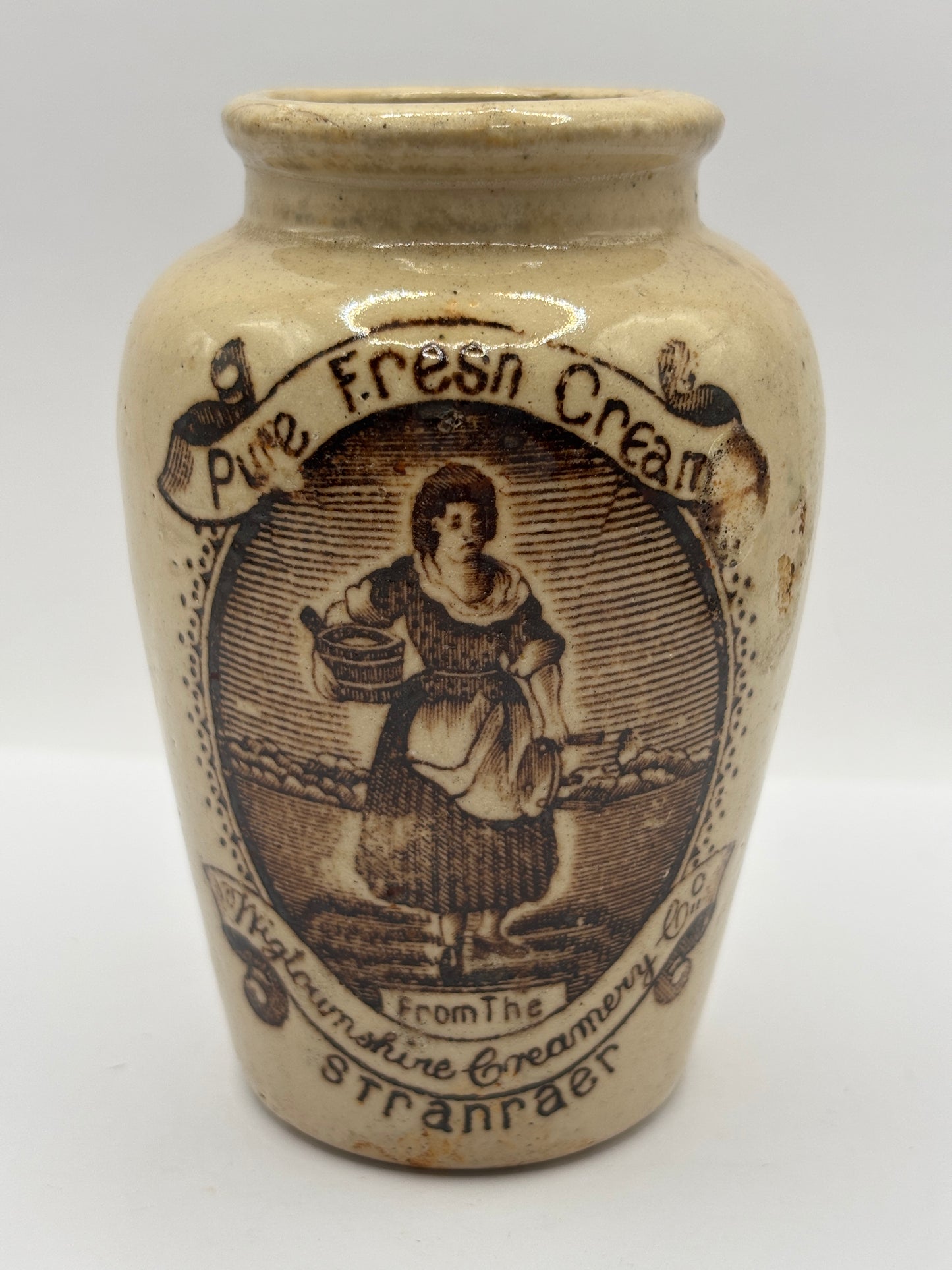 Old stoneware advertising cream pot, pure fresh cream Stranraer. Serpia print