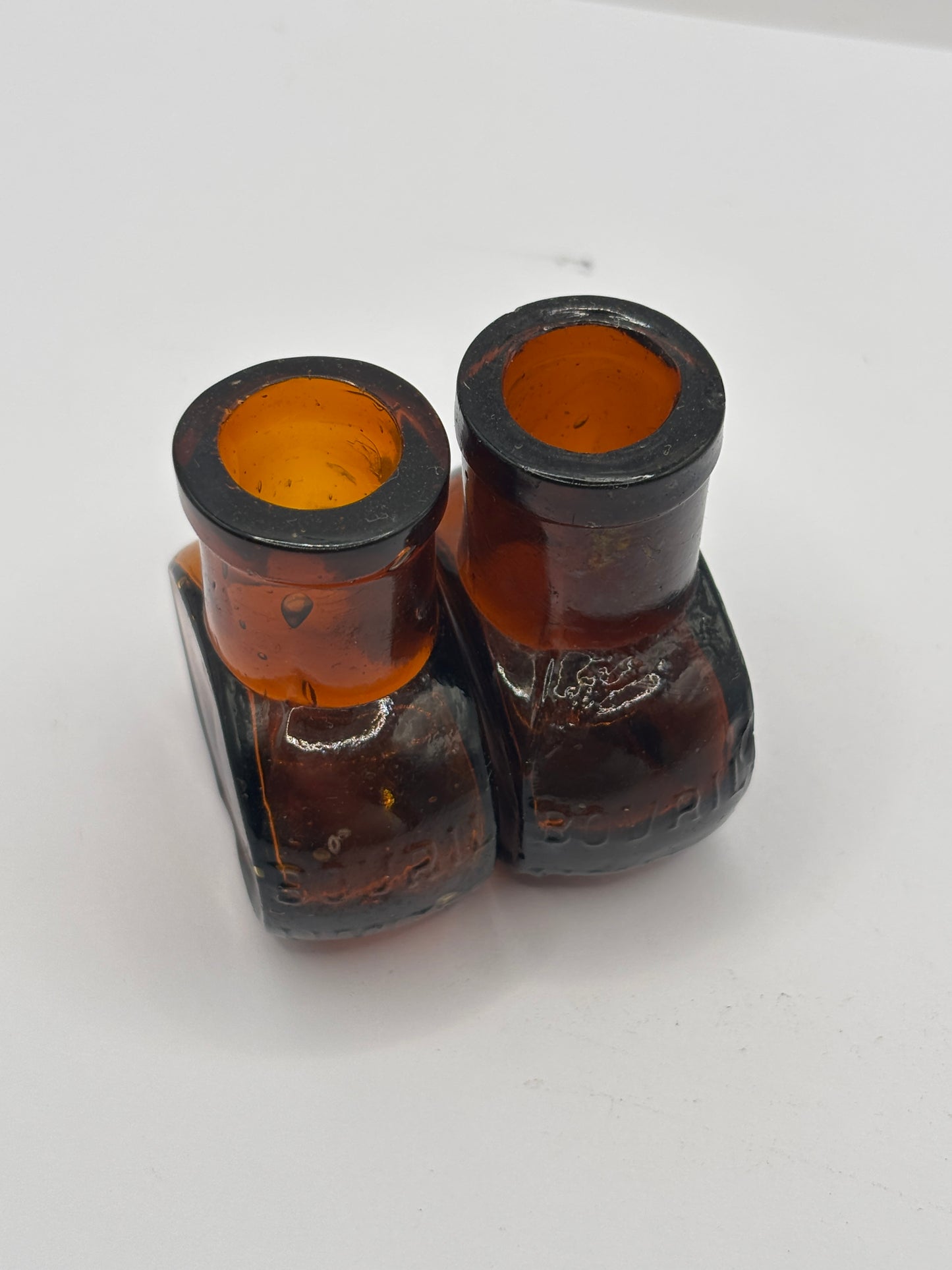 2 old mini bovril bottles